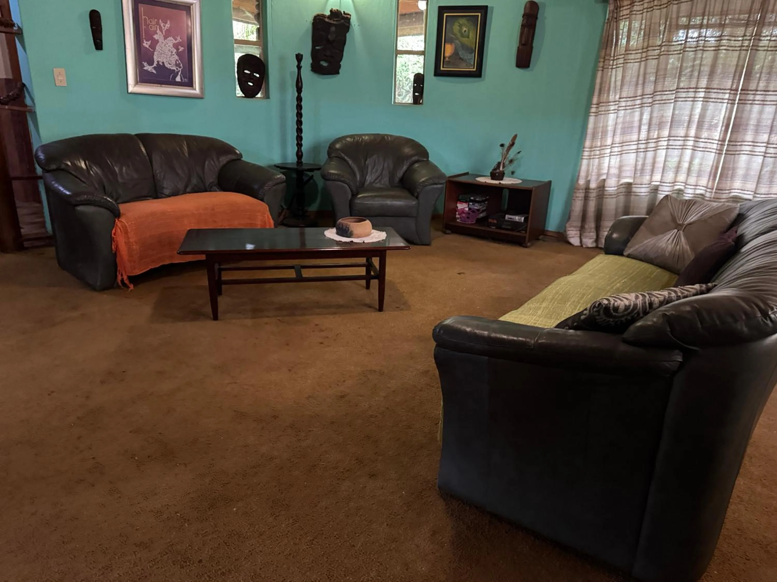 Communal lounge/ TV room in Sabie Gypsy's Backpackers