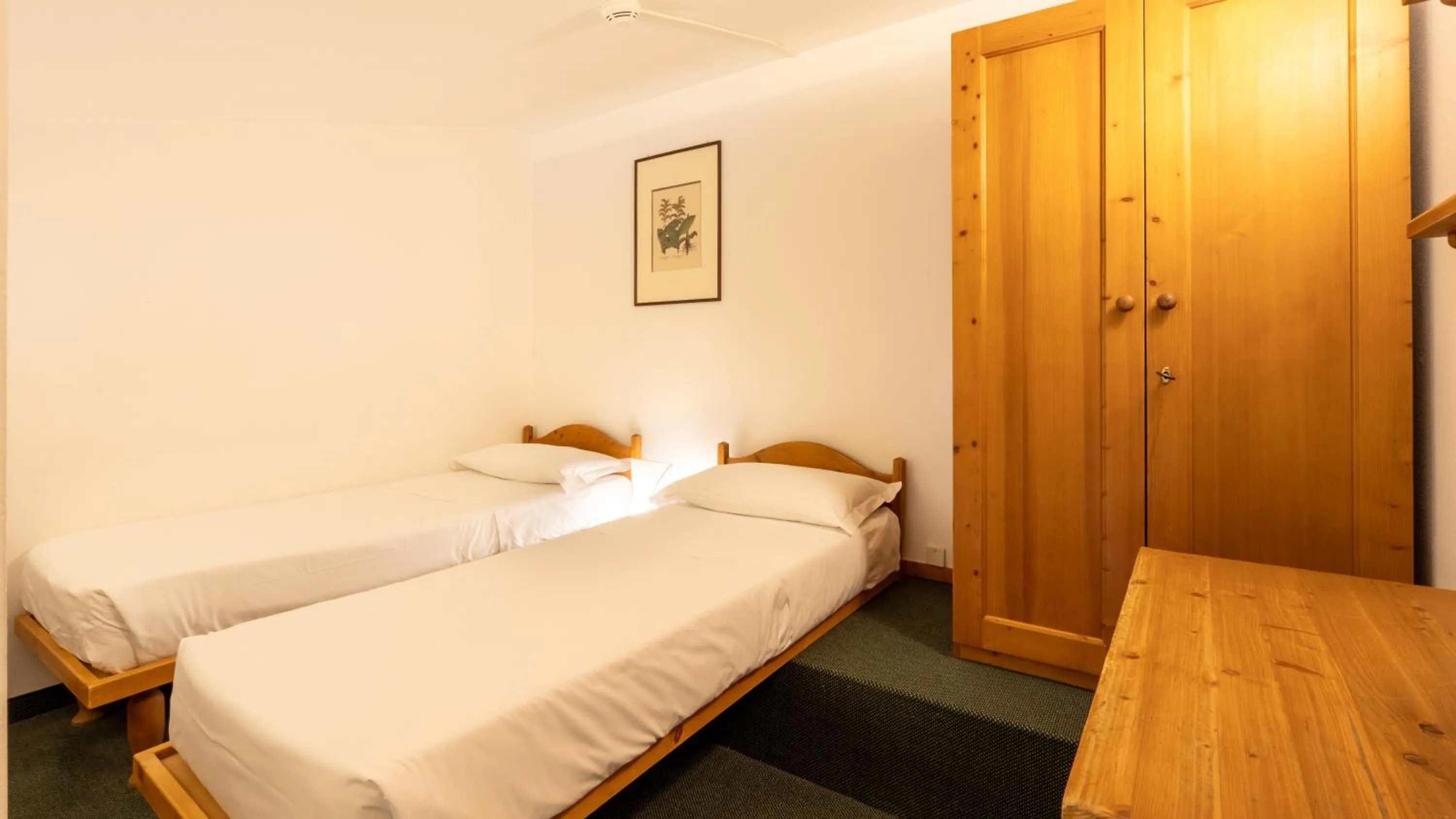 Bed in Hotel Cristallino d'Ampezzo