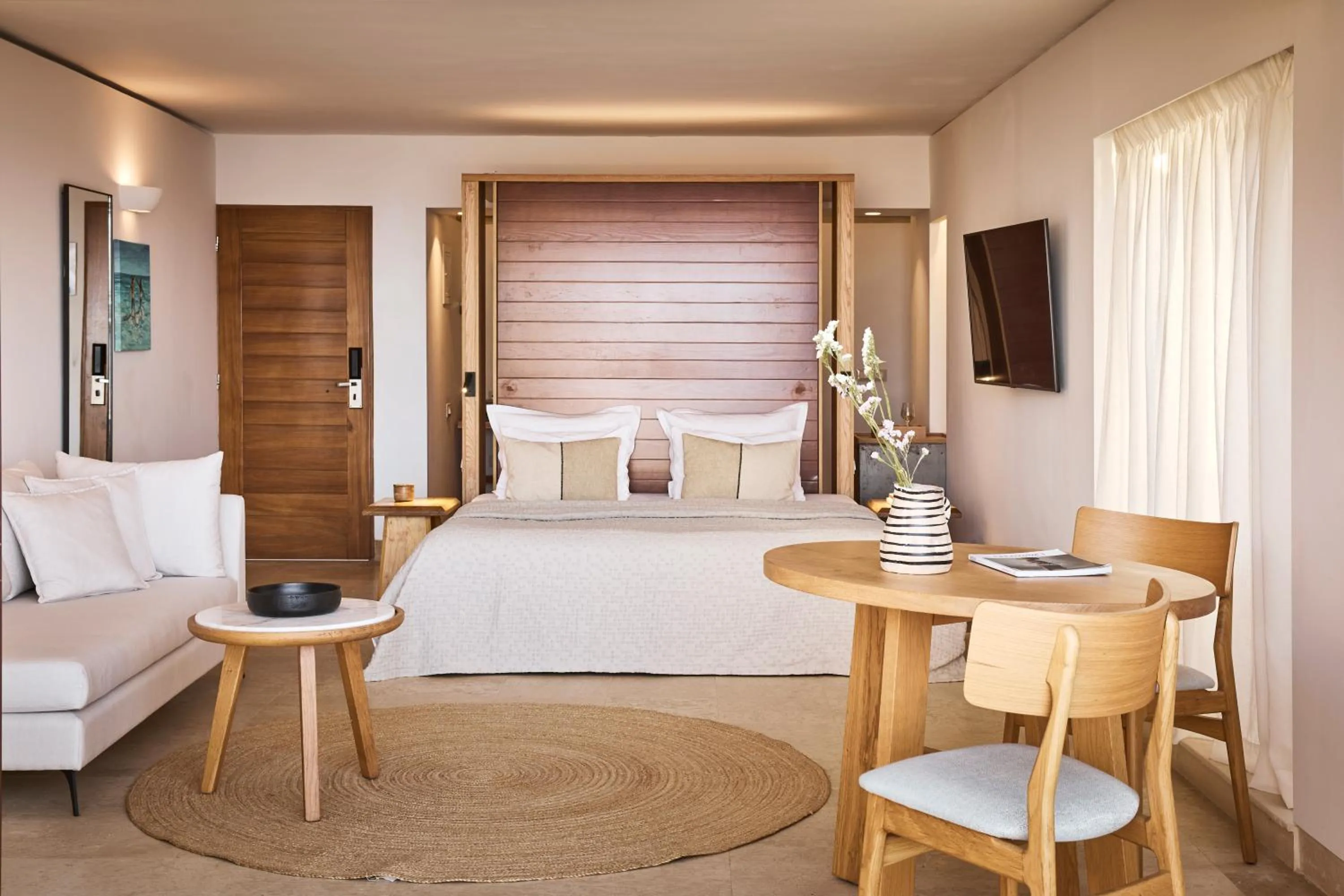 Seating area, Bed in St. Nicolas Bay Resort Hotel & Villas