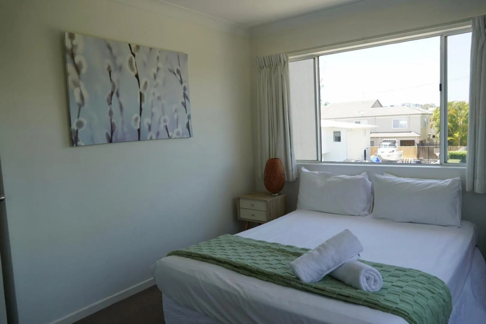 Bed in Pelican Cove Waterfront Apartment