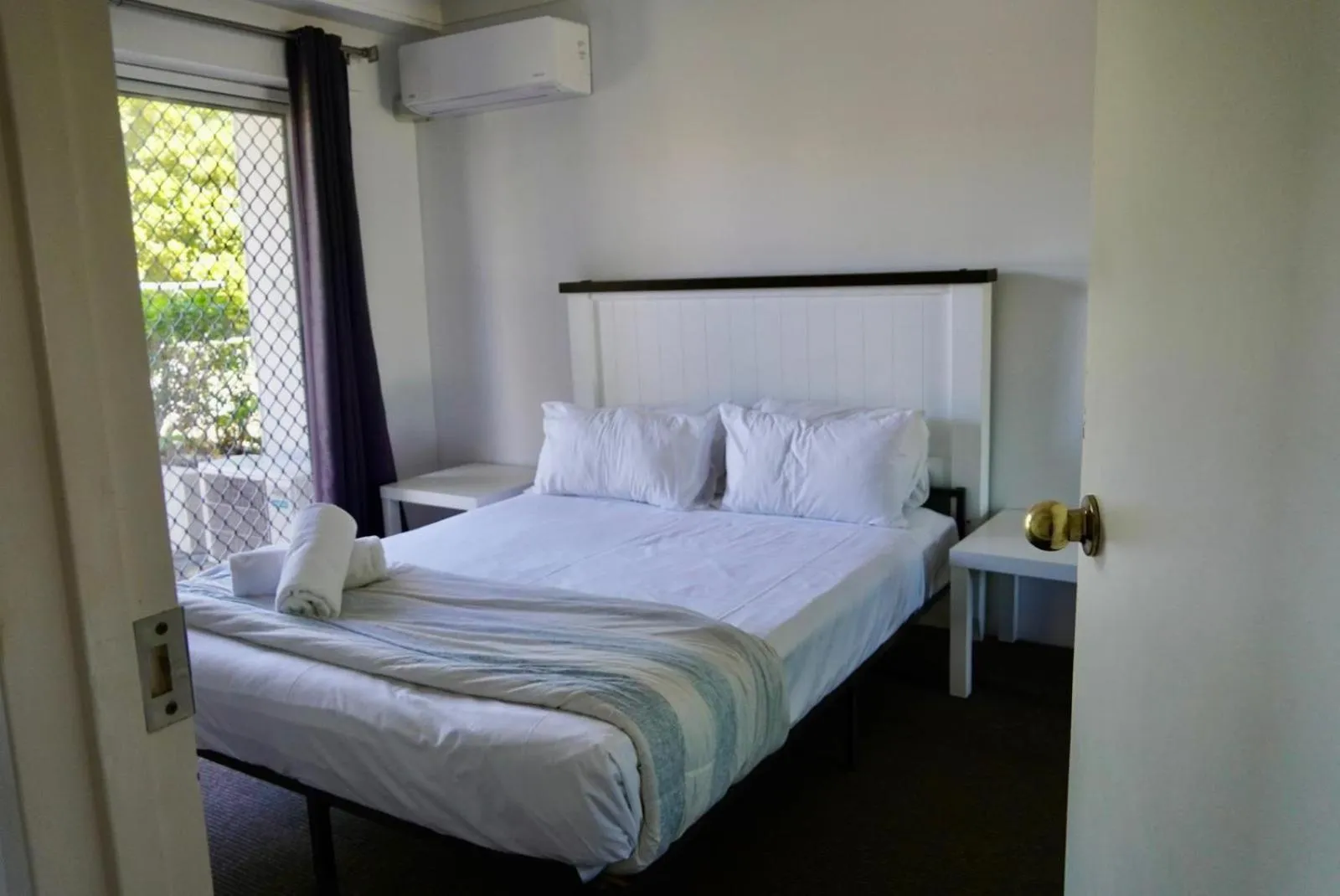 Bed in Pelican Cove Waterfront Apartment