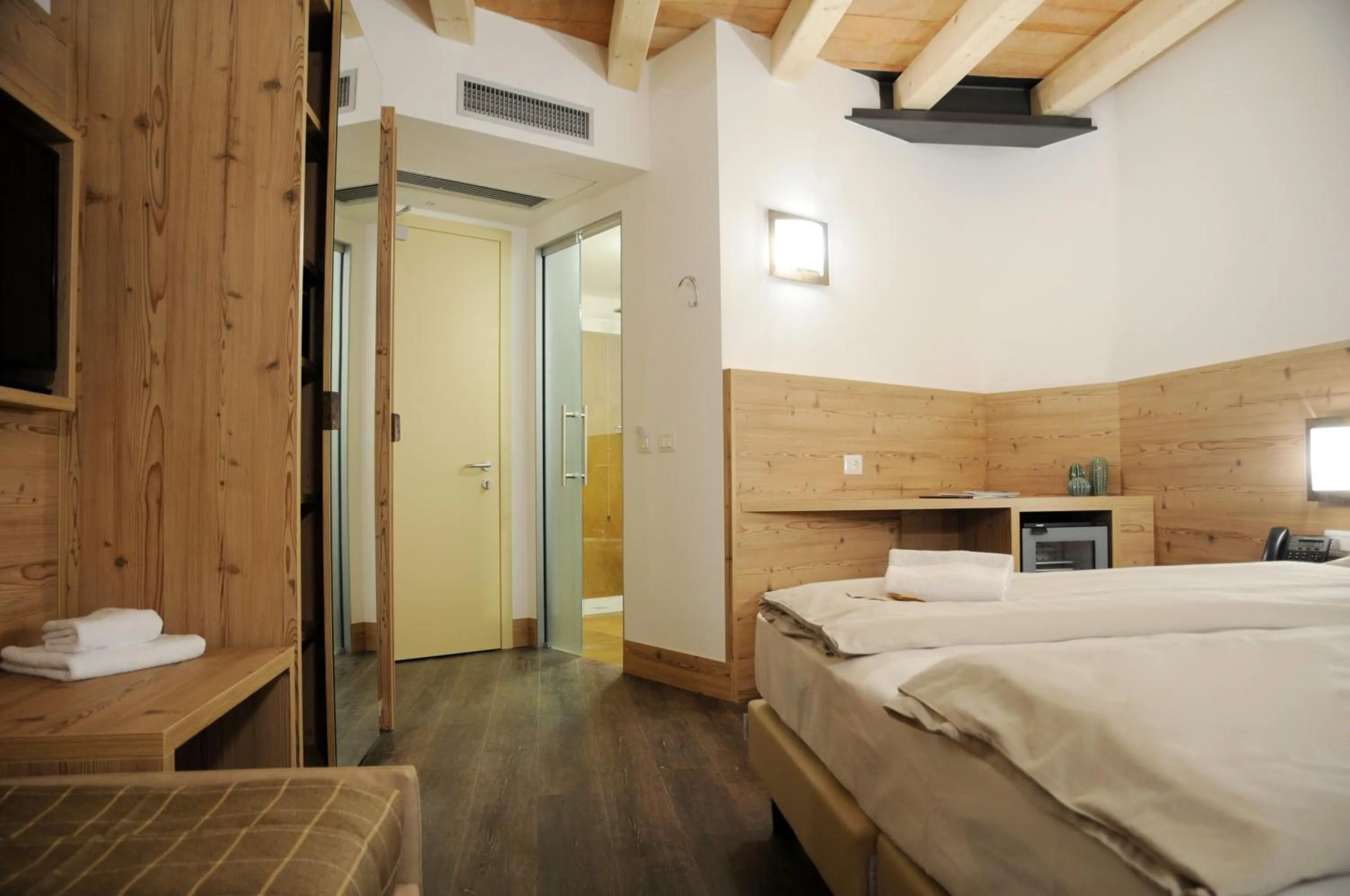 Bed in TOURING HOTEL & SPA