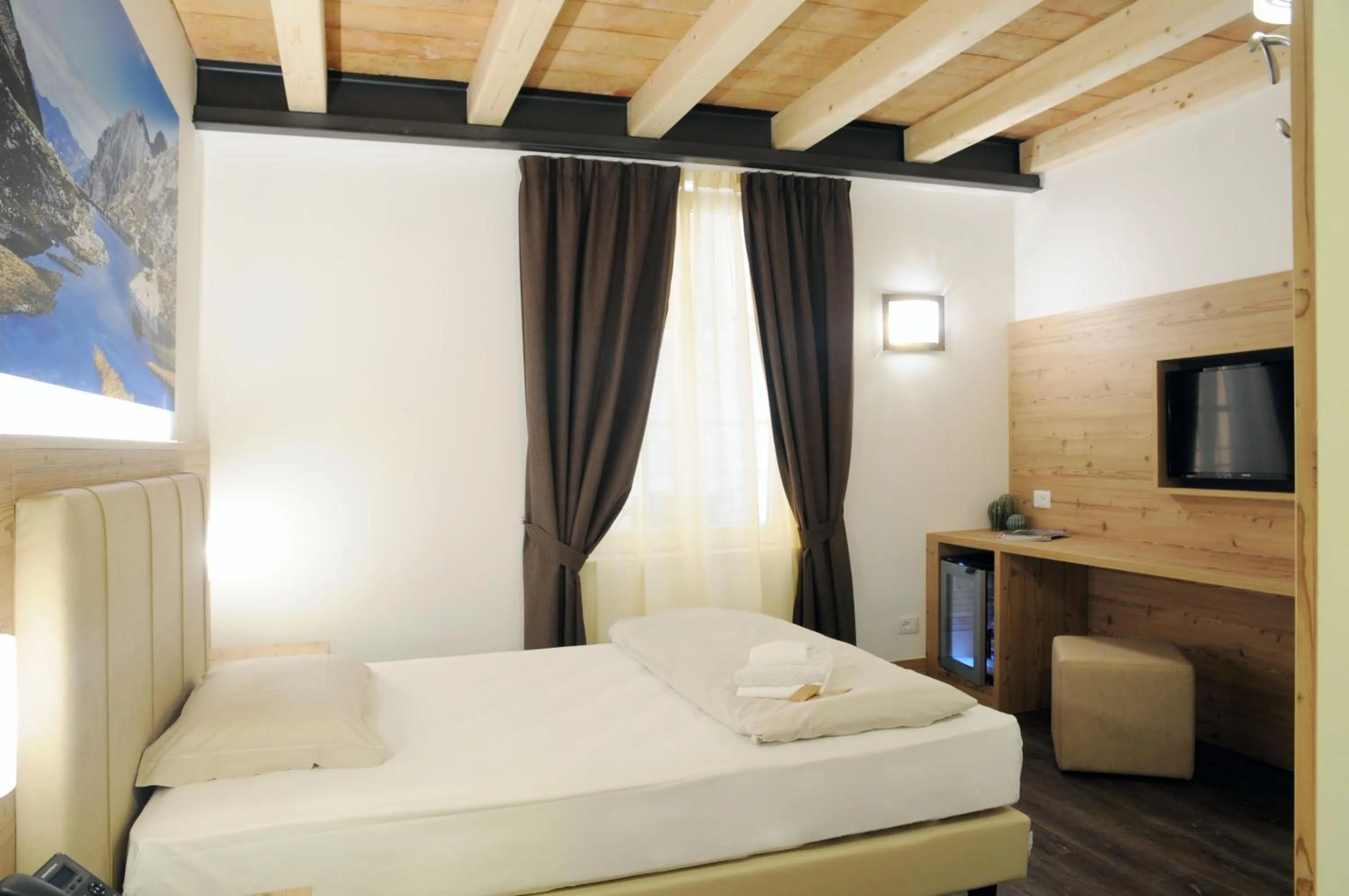 Bed in TOURING HOTEL & SPA