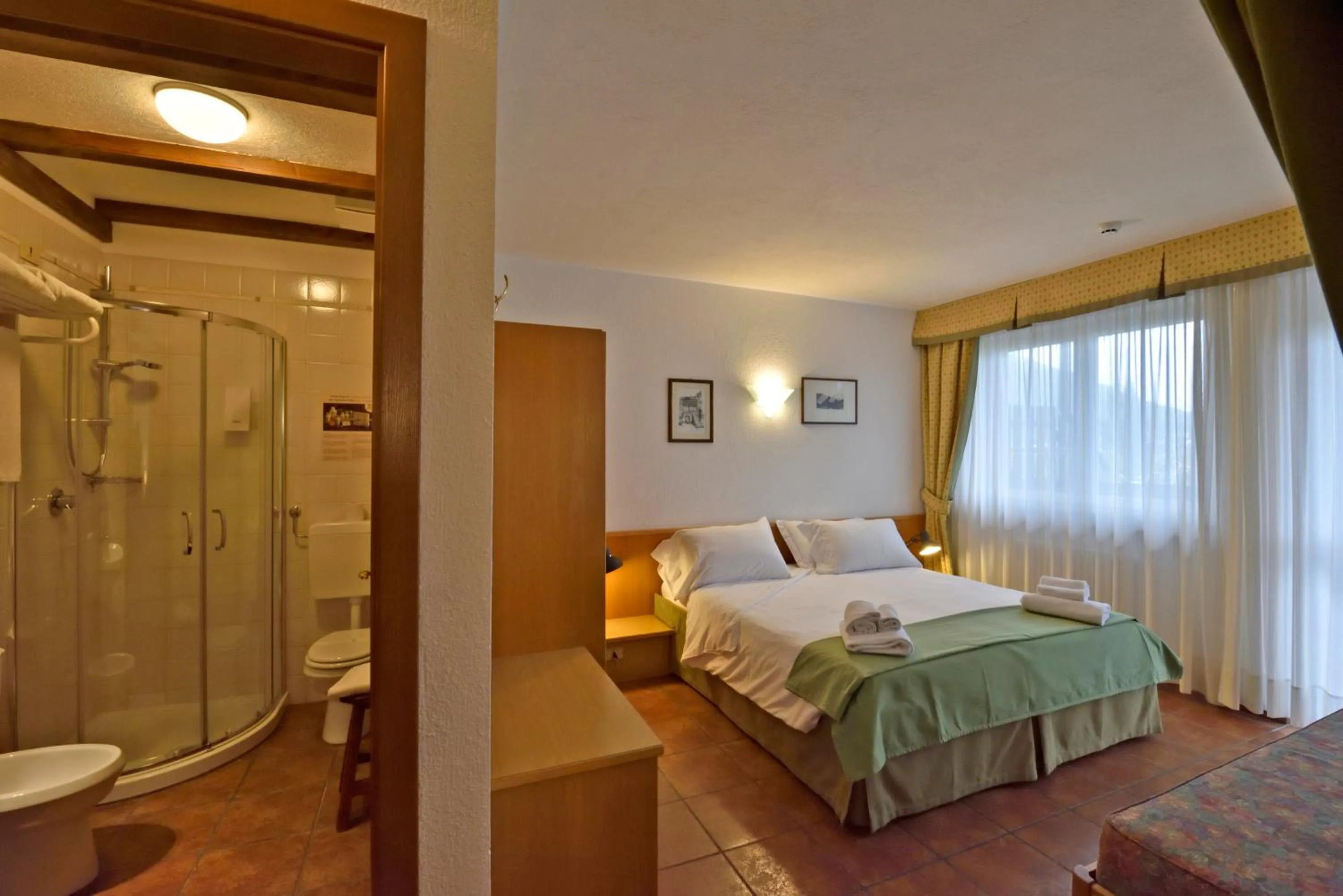 Bed in La Roche Hotel Appartments