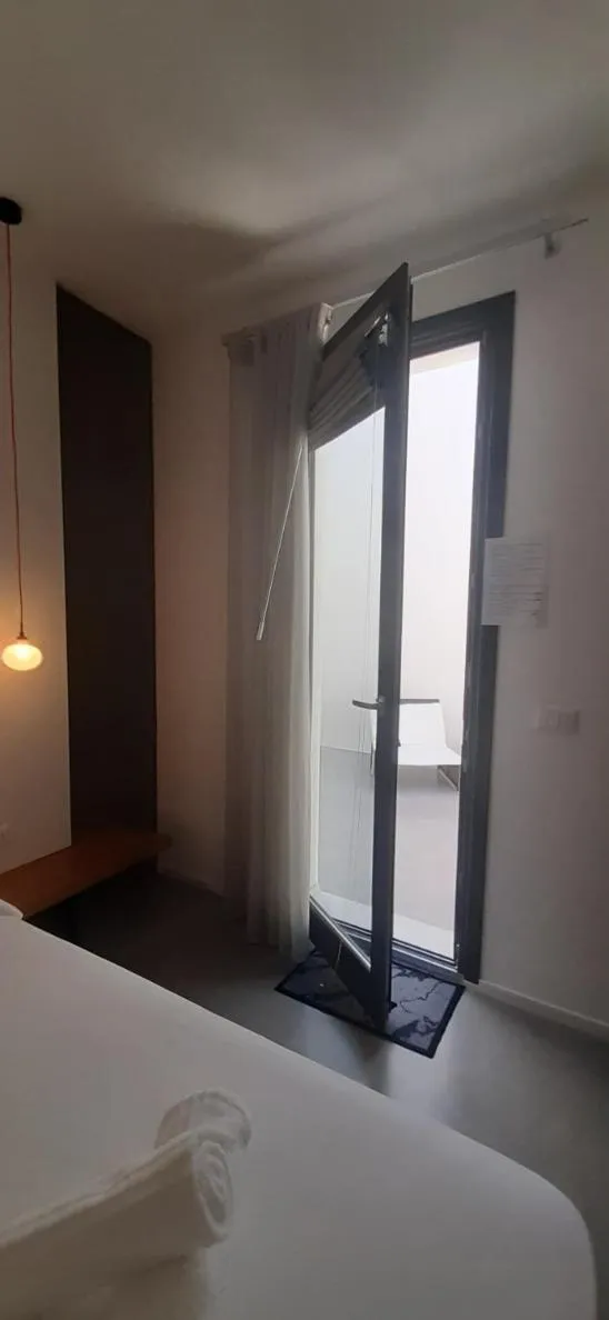 Photo of the whole room, Bed in Patio 101 "Exclusive"