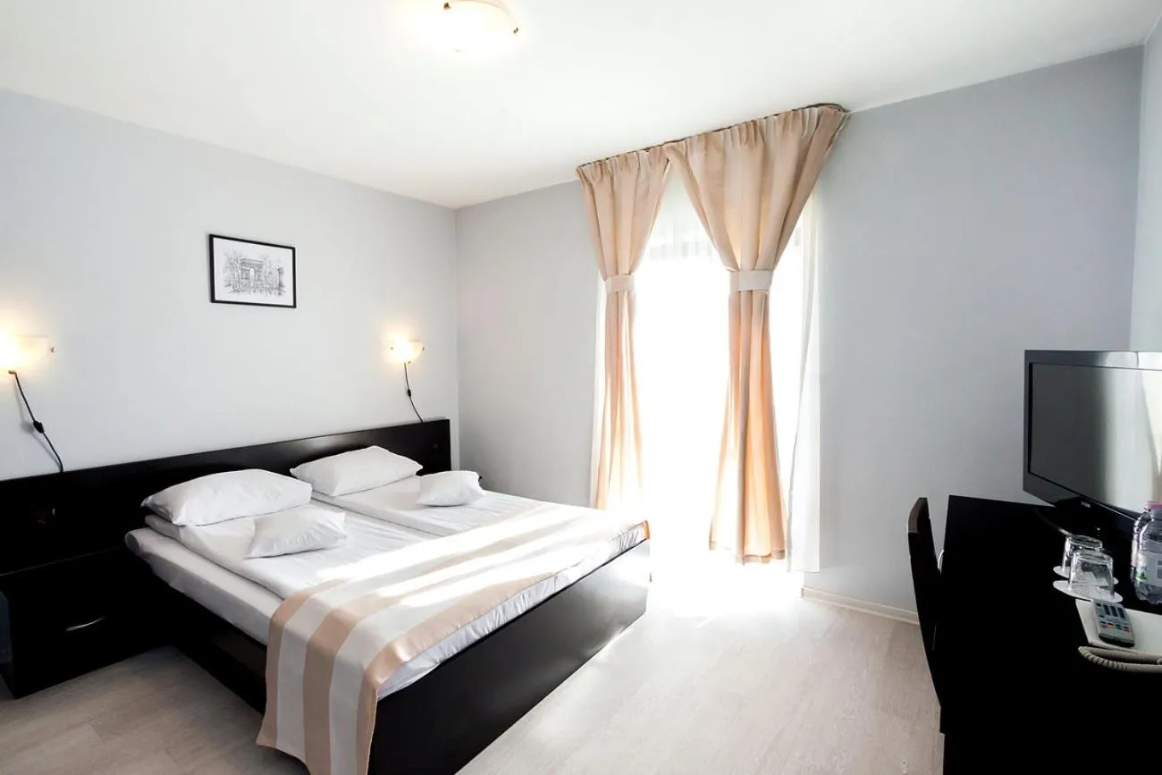 Bed in Astoria Hotel & Restaurant