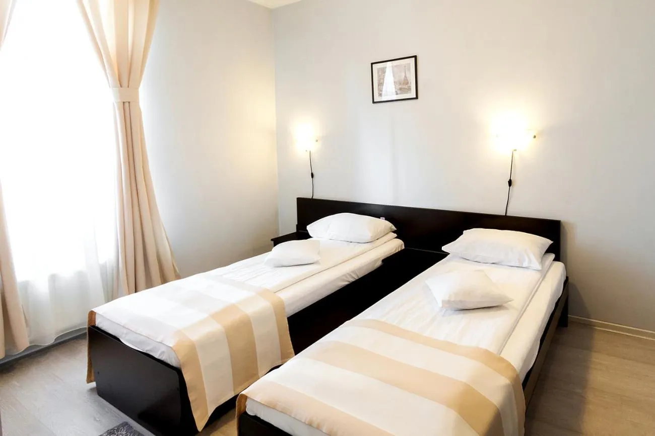 Bed in Astoria Hotel & Restaurant