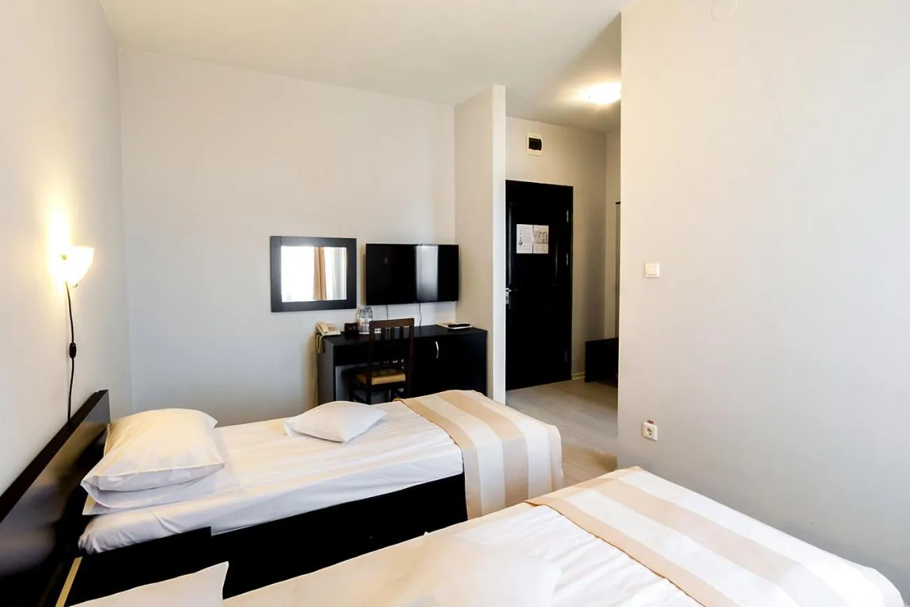 Bed in Astoria Hotel & Restaurant