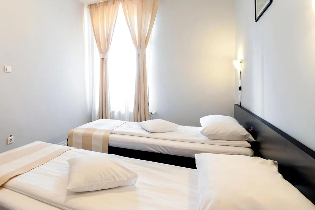 Bed in Astoria Hotel & Restaurant