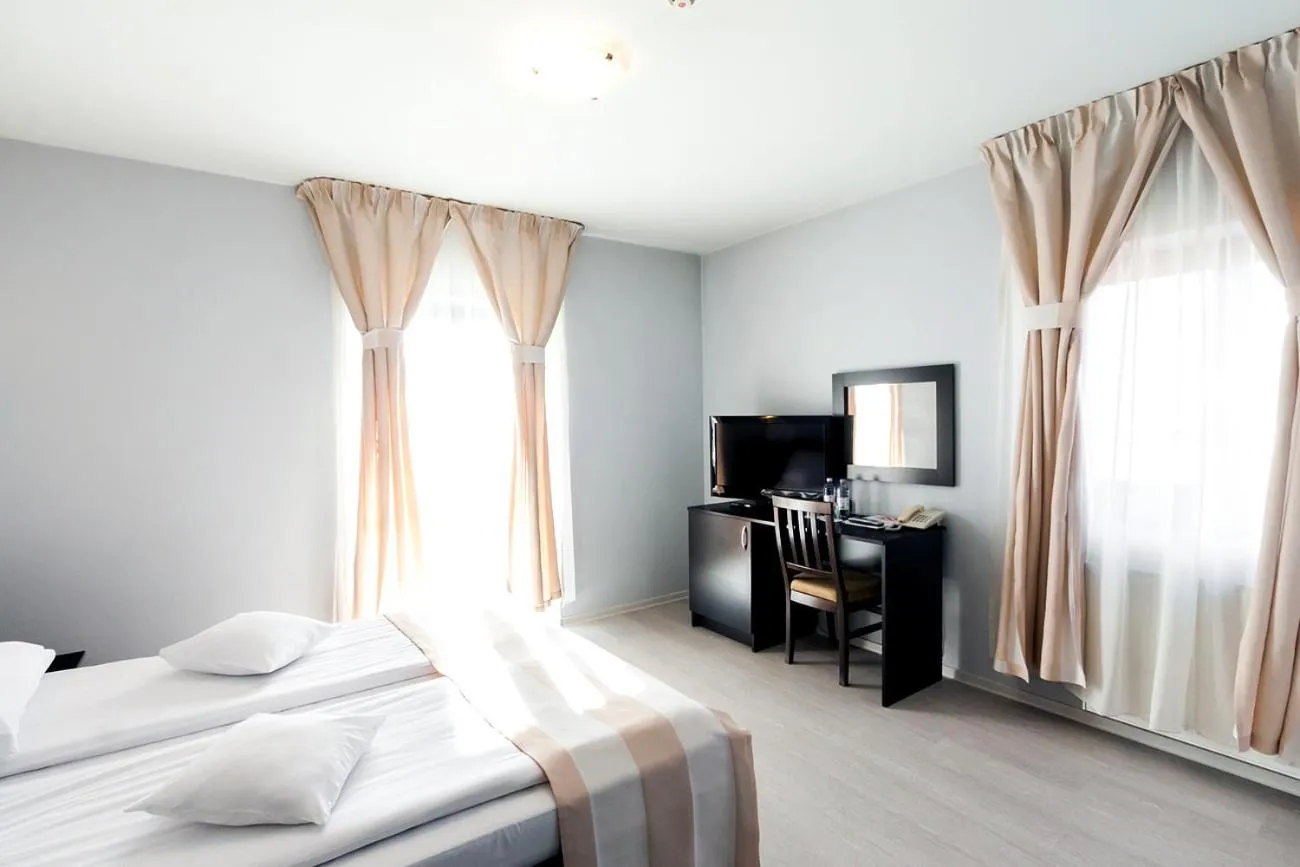 Bed in Astoria Hotel & Restaurant