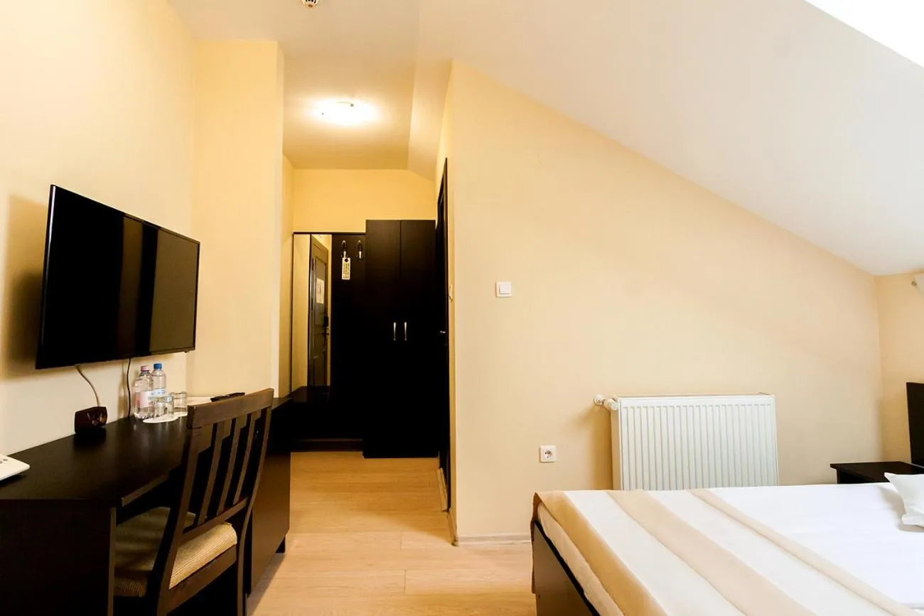 Bed in Astoria Hotel & Restaurant