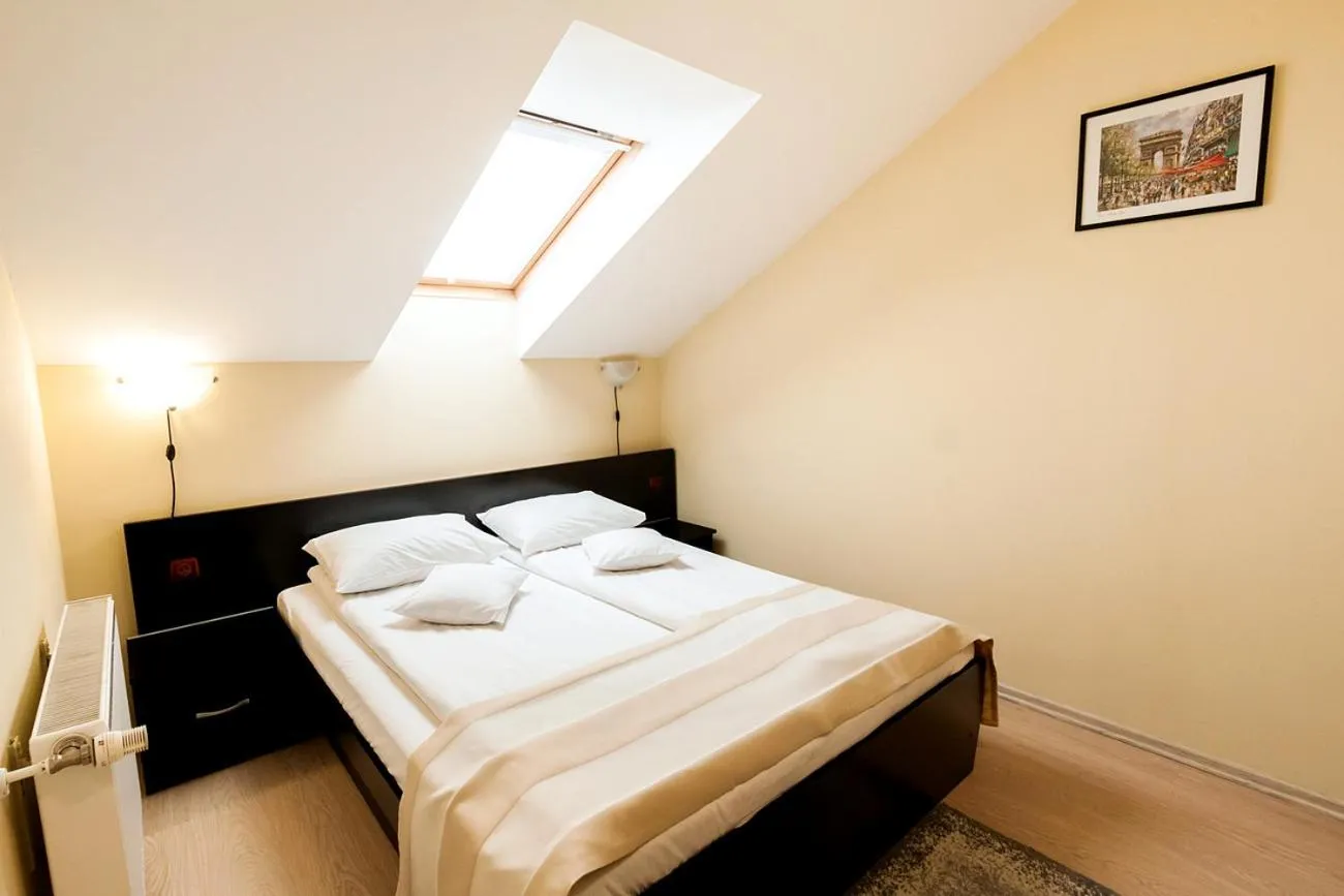 Bed in Astoria Hotel & Restaurant