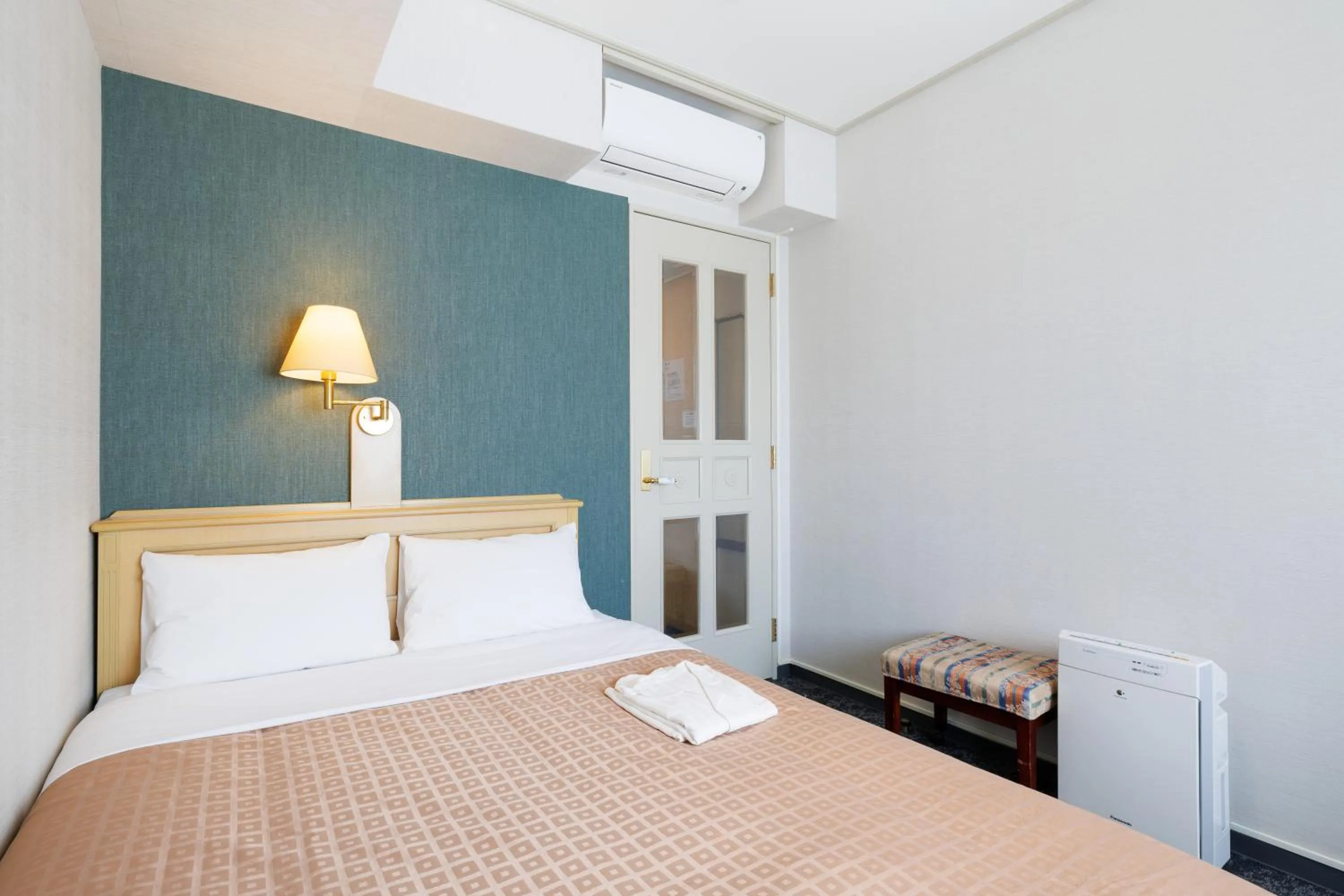 Bed in Hiroshima Intelligent Hotel Annex