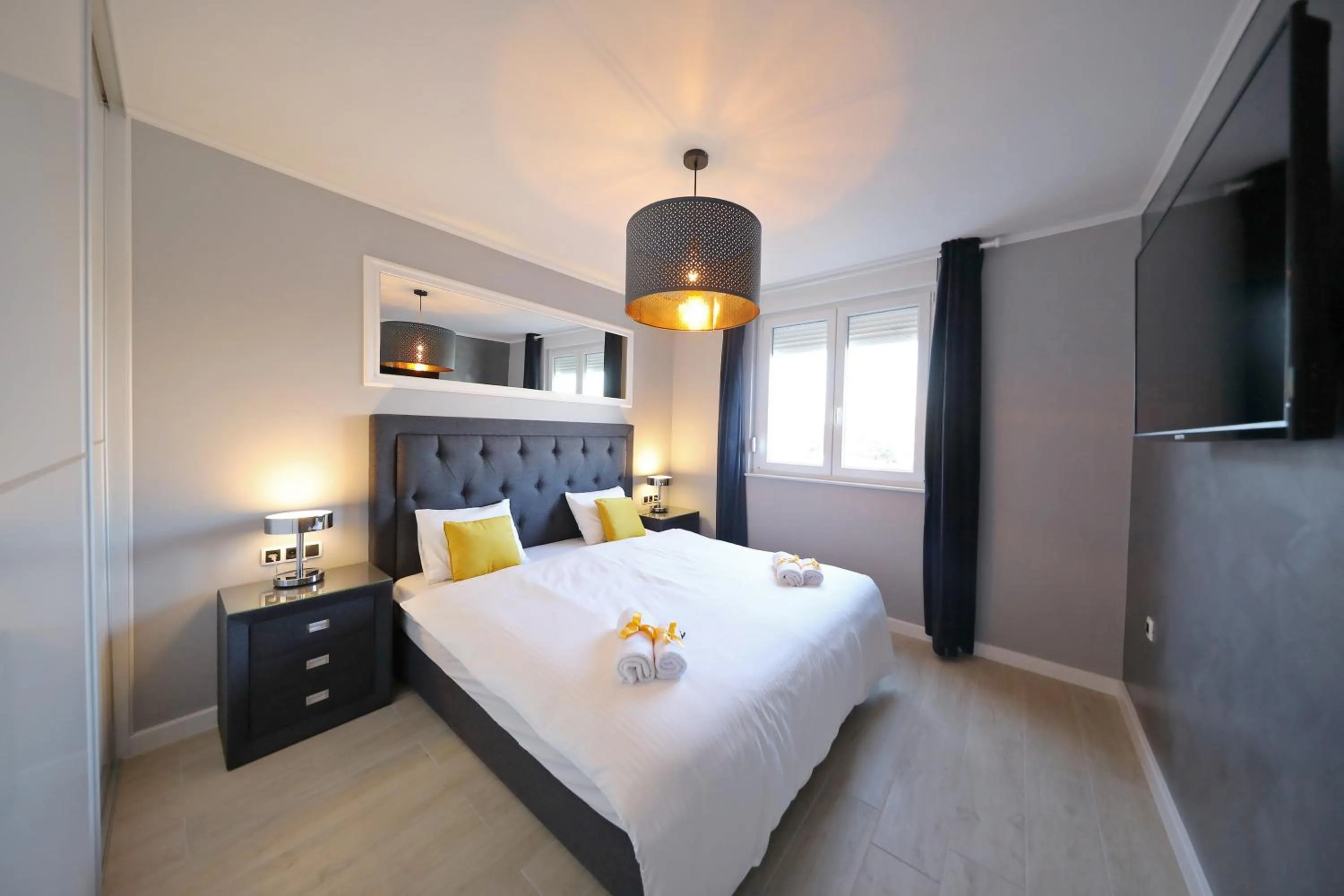 Bed in City Marine Luxury Apartments