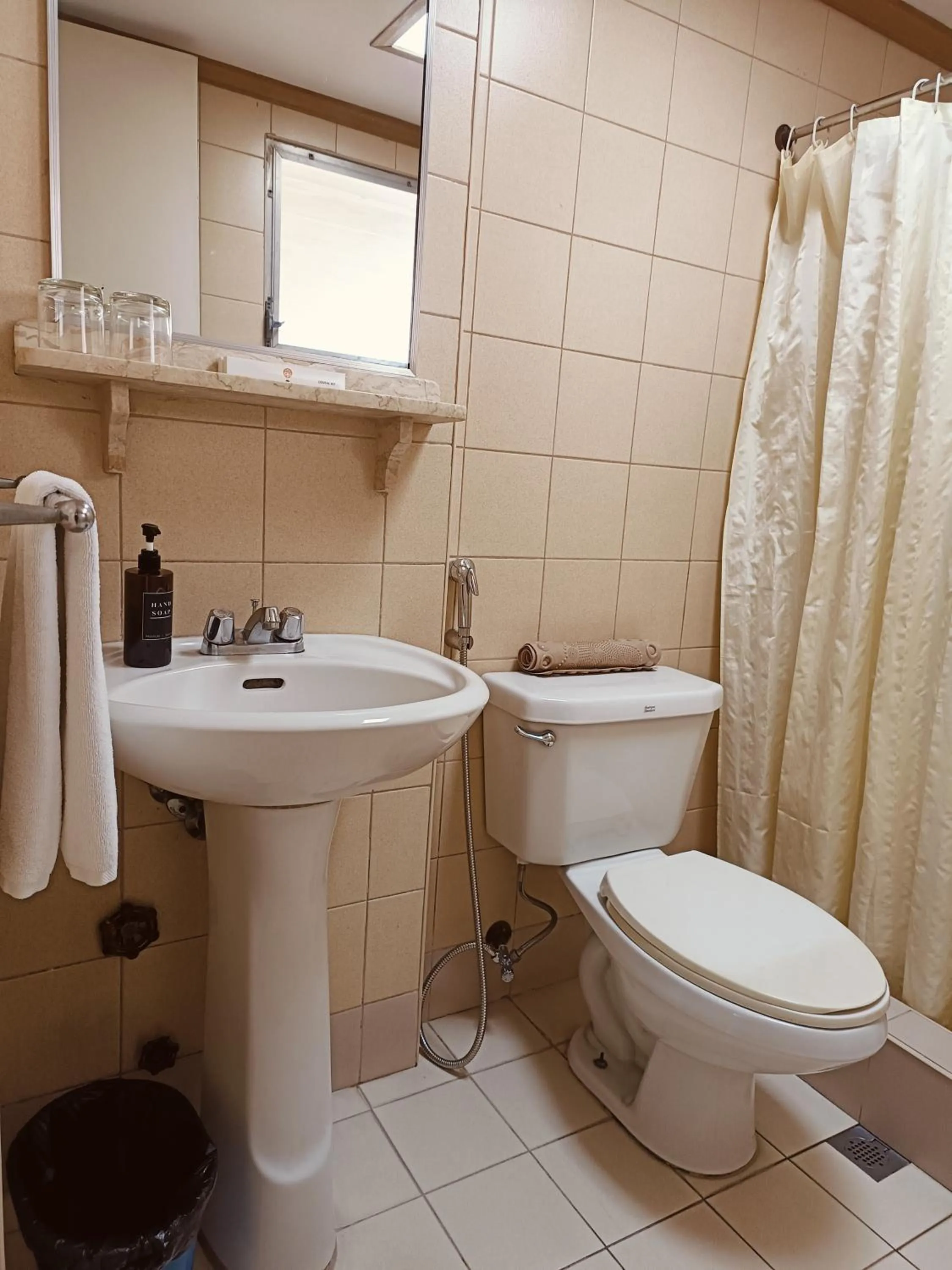 Toilet in Tropicana Suites