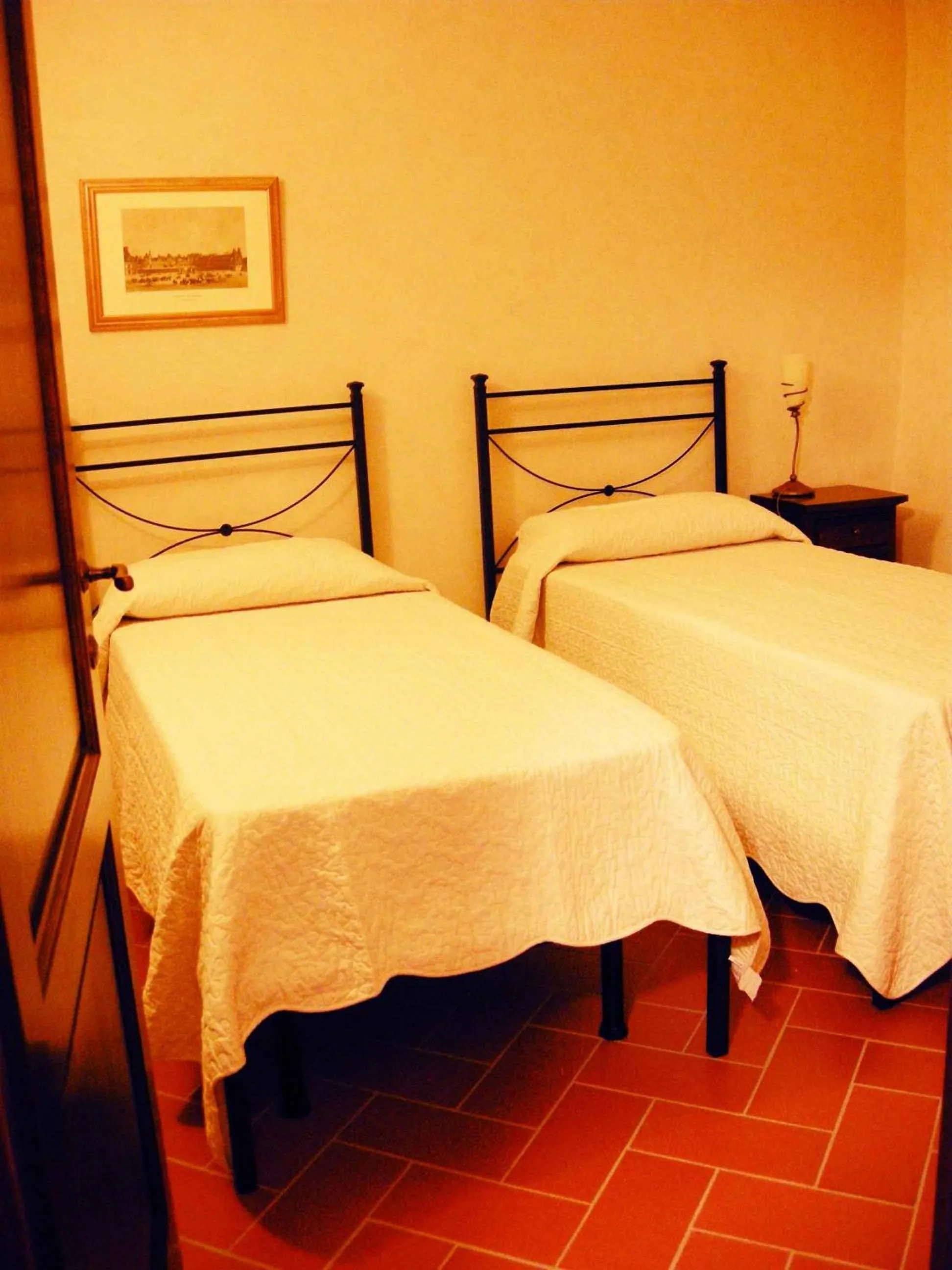 Bed in Relais Villa Sensano