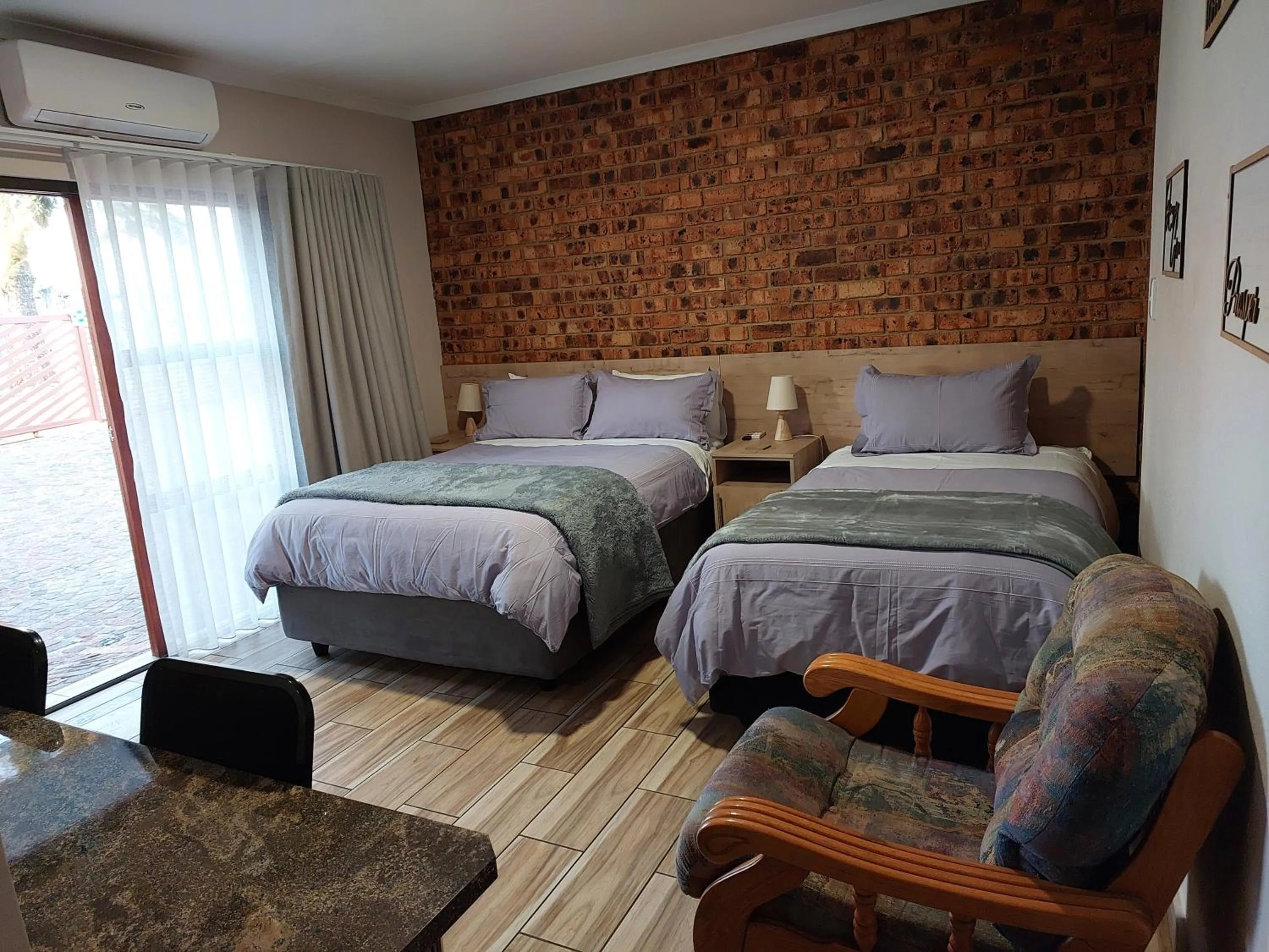 Bed in Twins Guest House Astoni