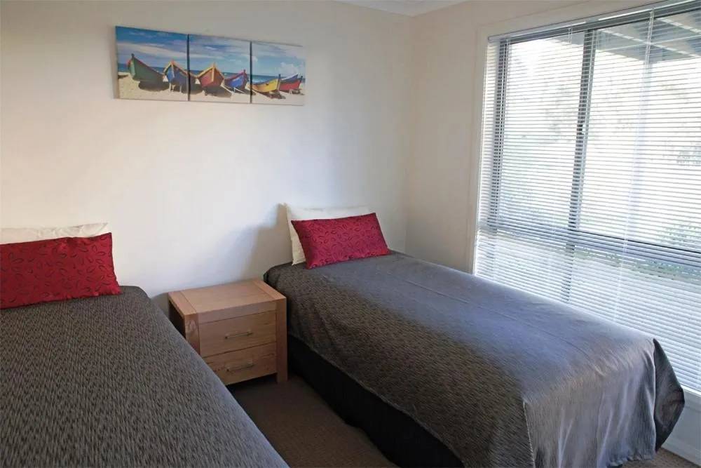 Bed in Amooran Oceanside Apartments and Motel