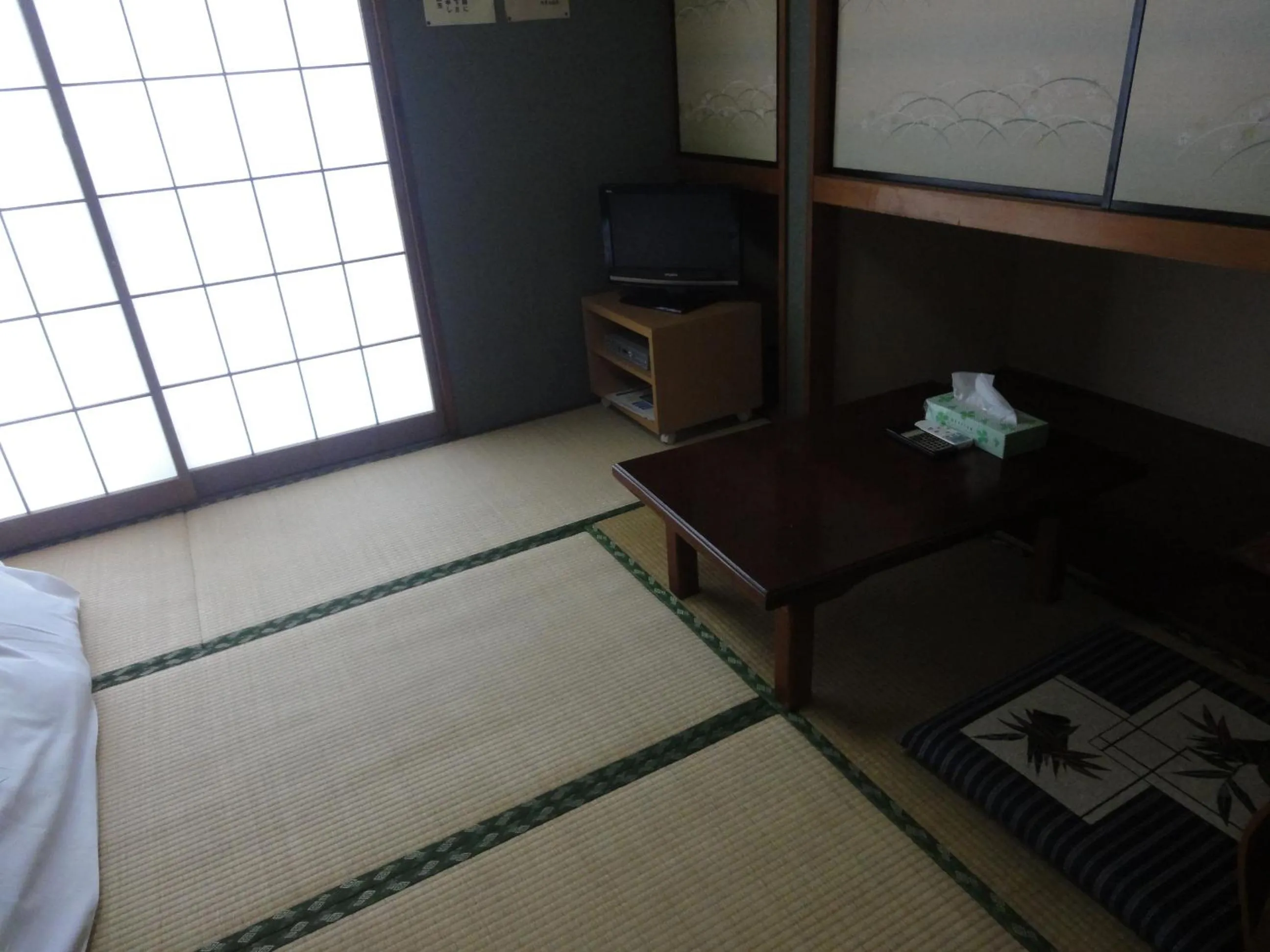 Bed in Hotel Sankyu