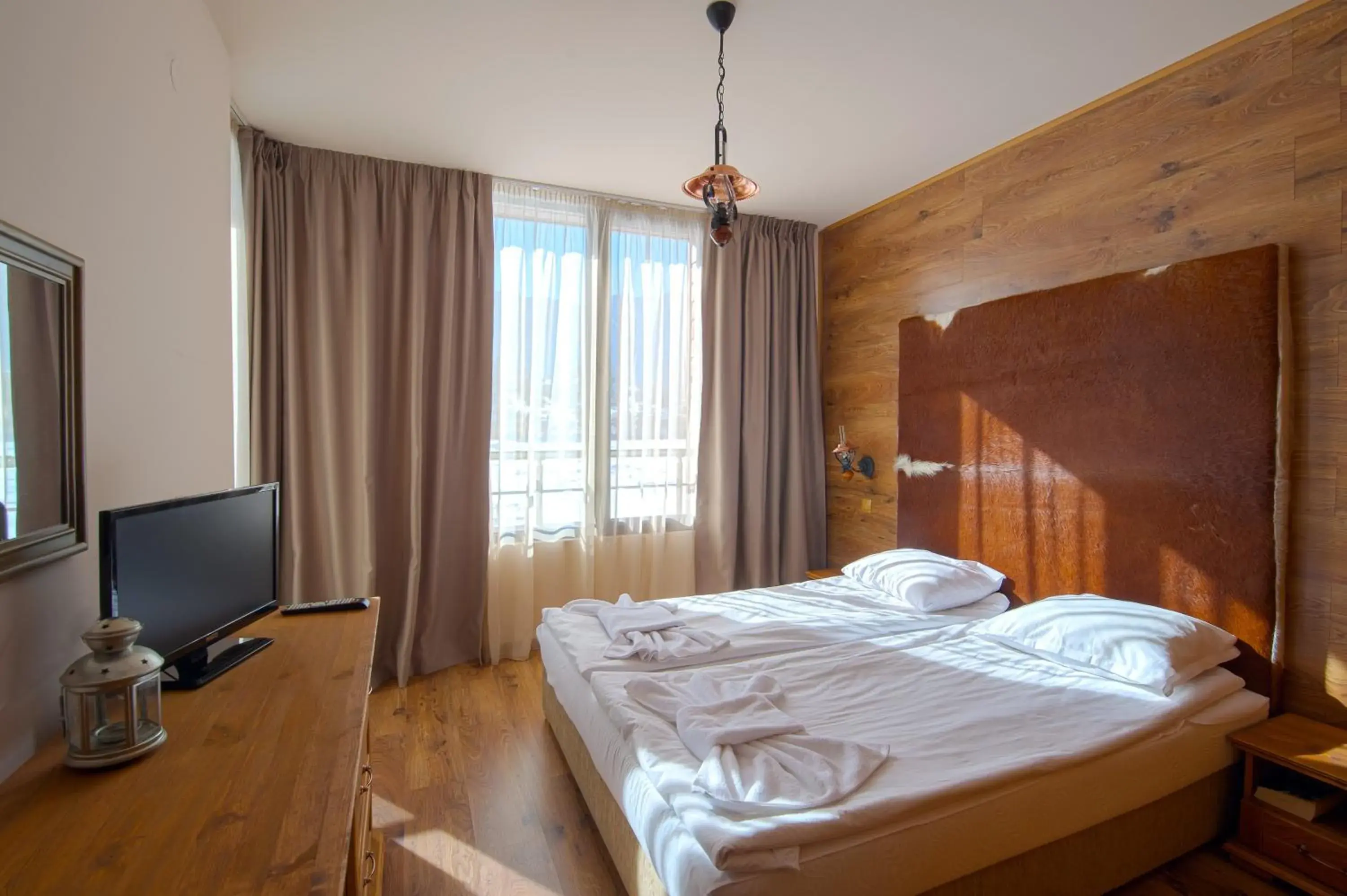 Communal lounge/ TV room, Bed in Cornelia Deluxe Residence Communal lounge/ TV room, Bed in Cornelia Deluxe Residence