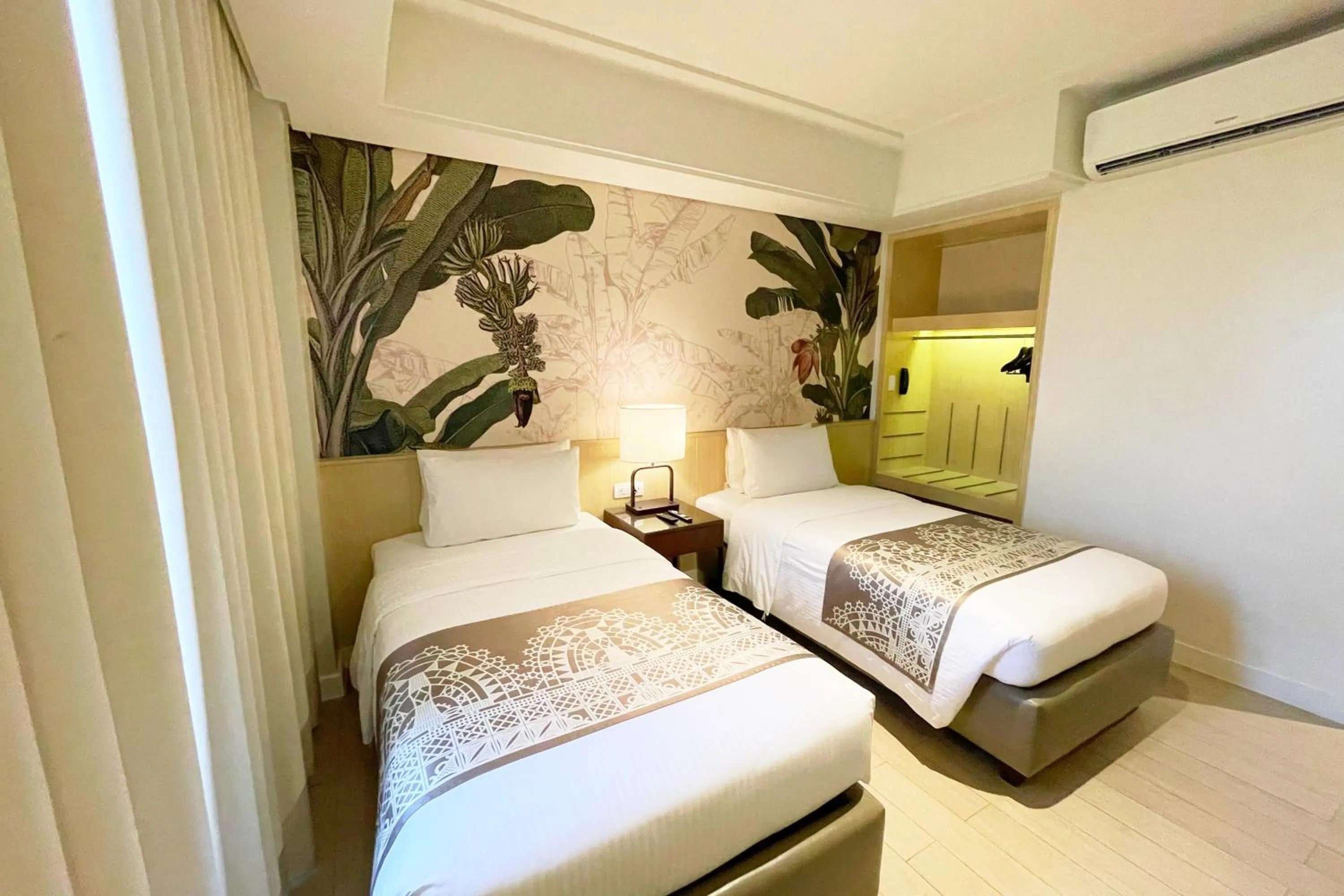 Bed in Mella Hotel Manila near NAIA Airport