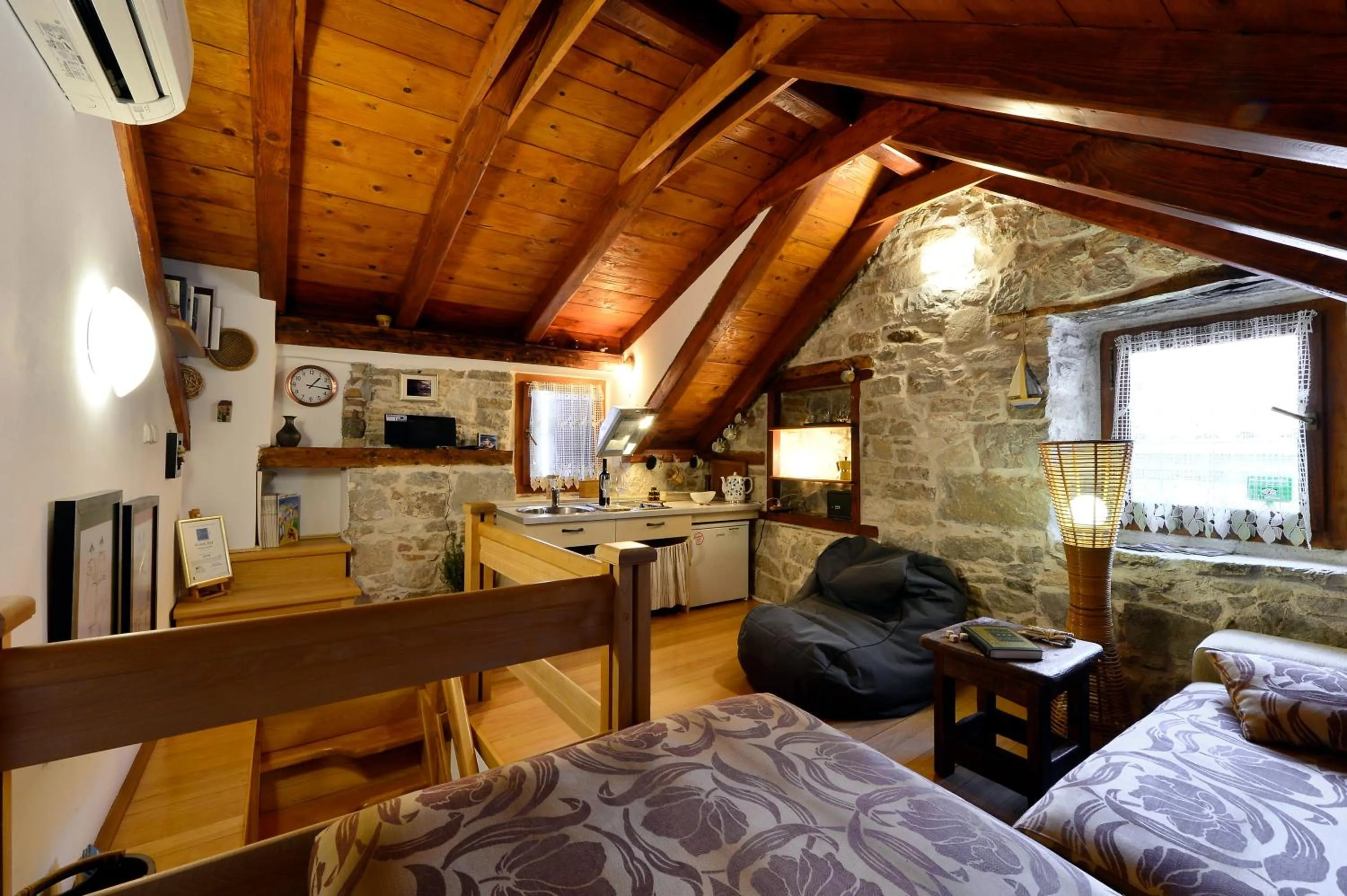 Living room, Bed in Apartments Salvezani