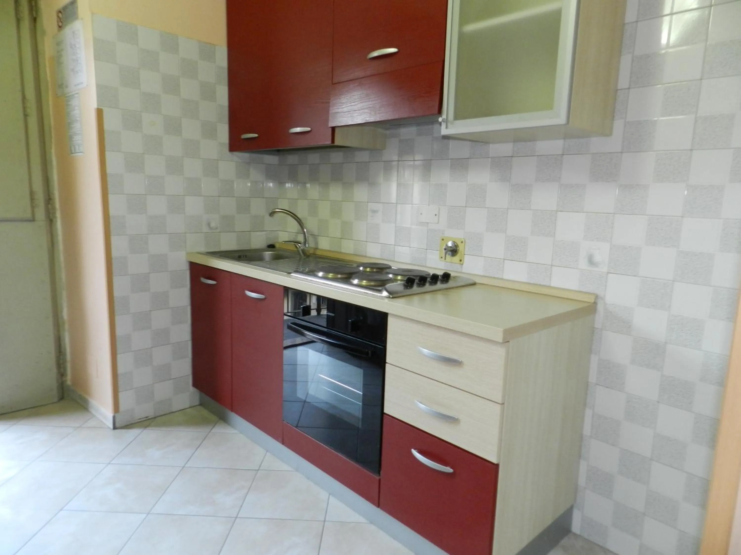 Kitchen or kitchenette in Appartamenti Valdocco
