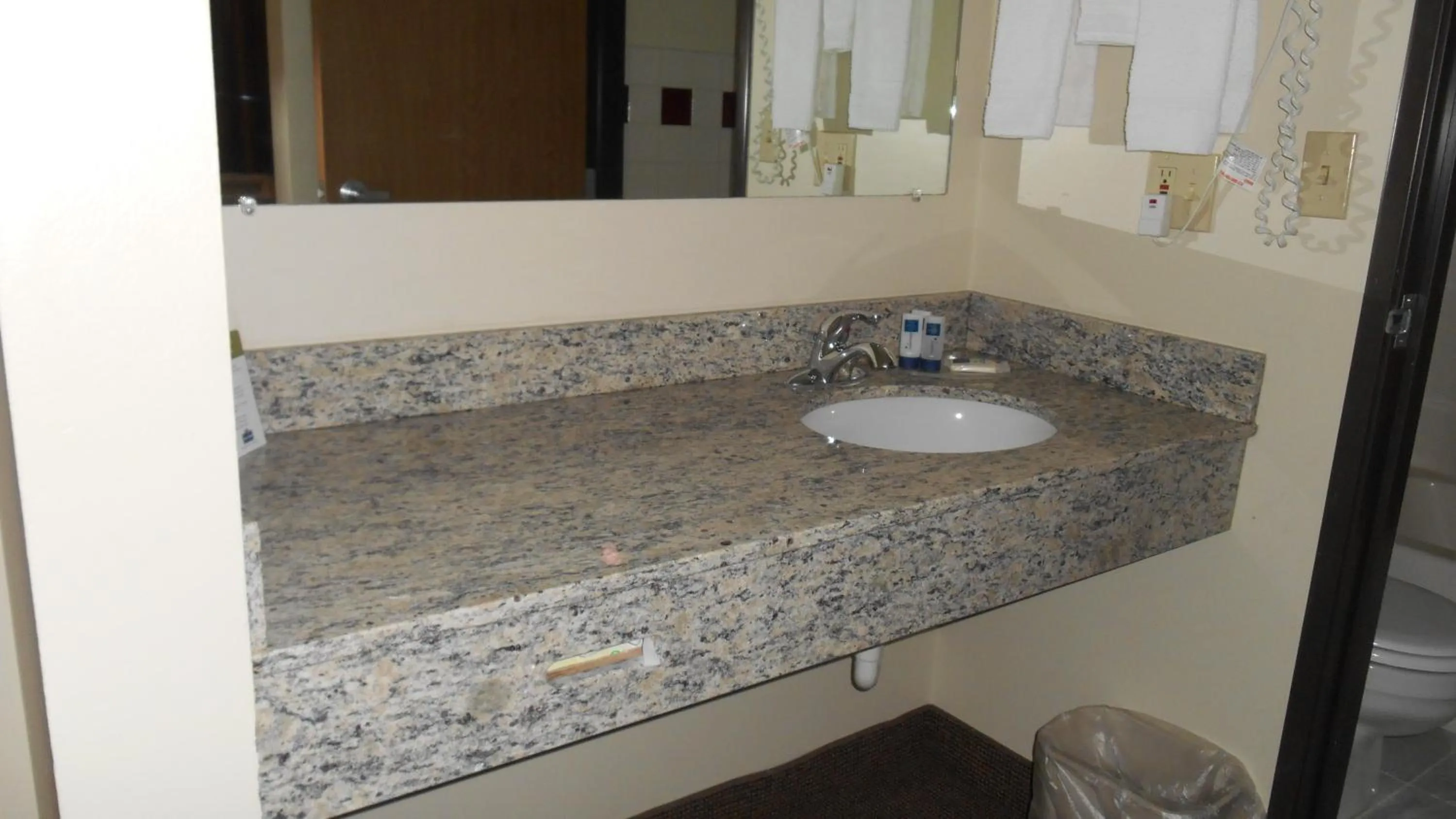 Bathroom in AmericInn by Wyndham Tomah