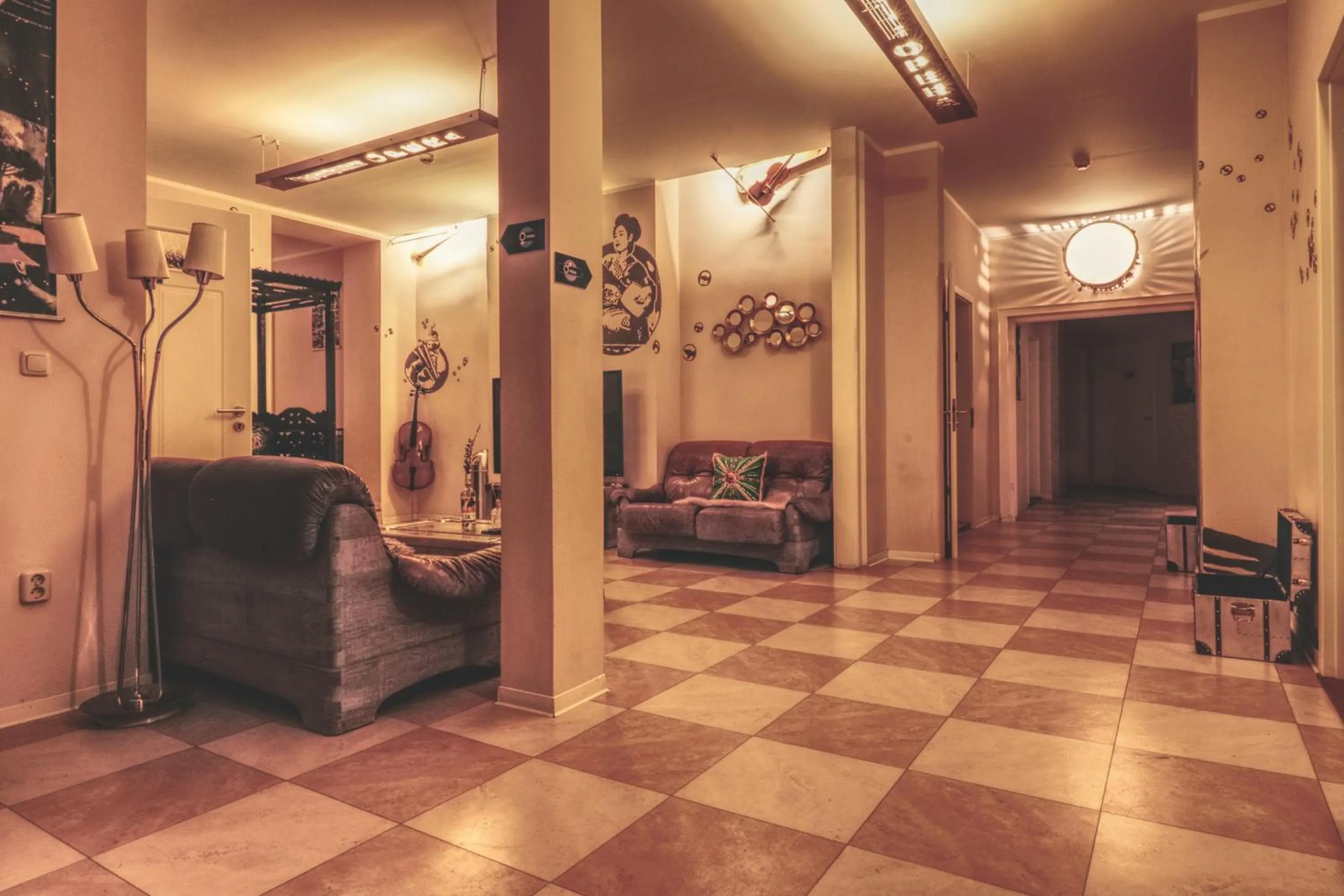 Communal lounge/ TV room in OPERA Hostel