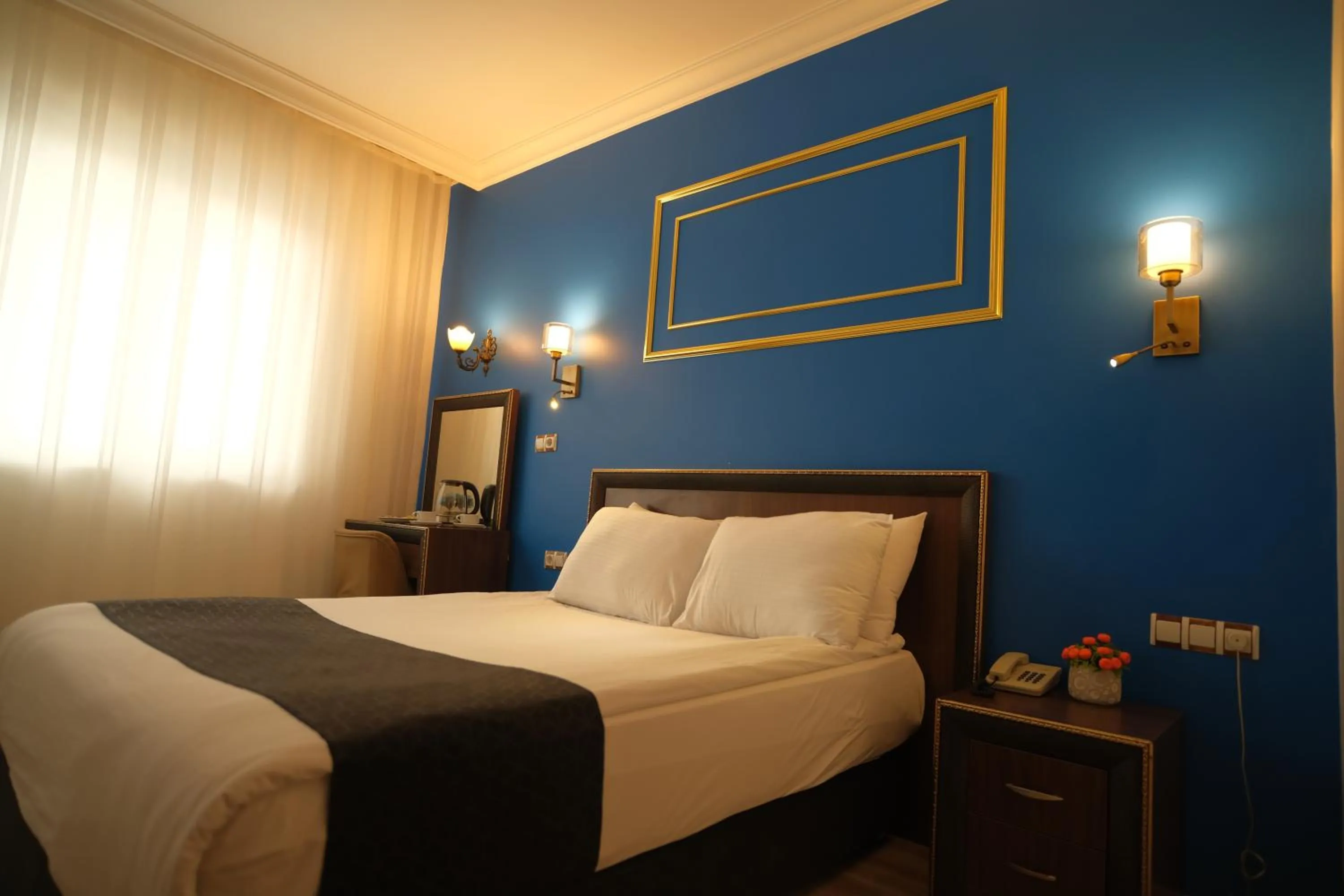 Bedroom in Malabadi Hotel