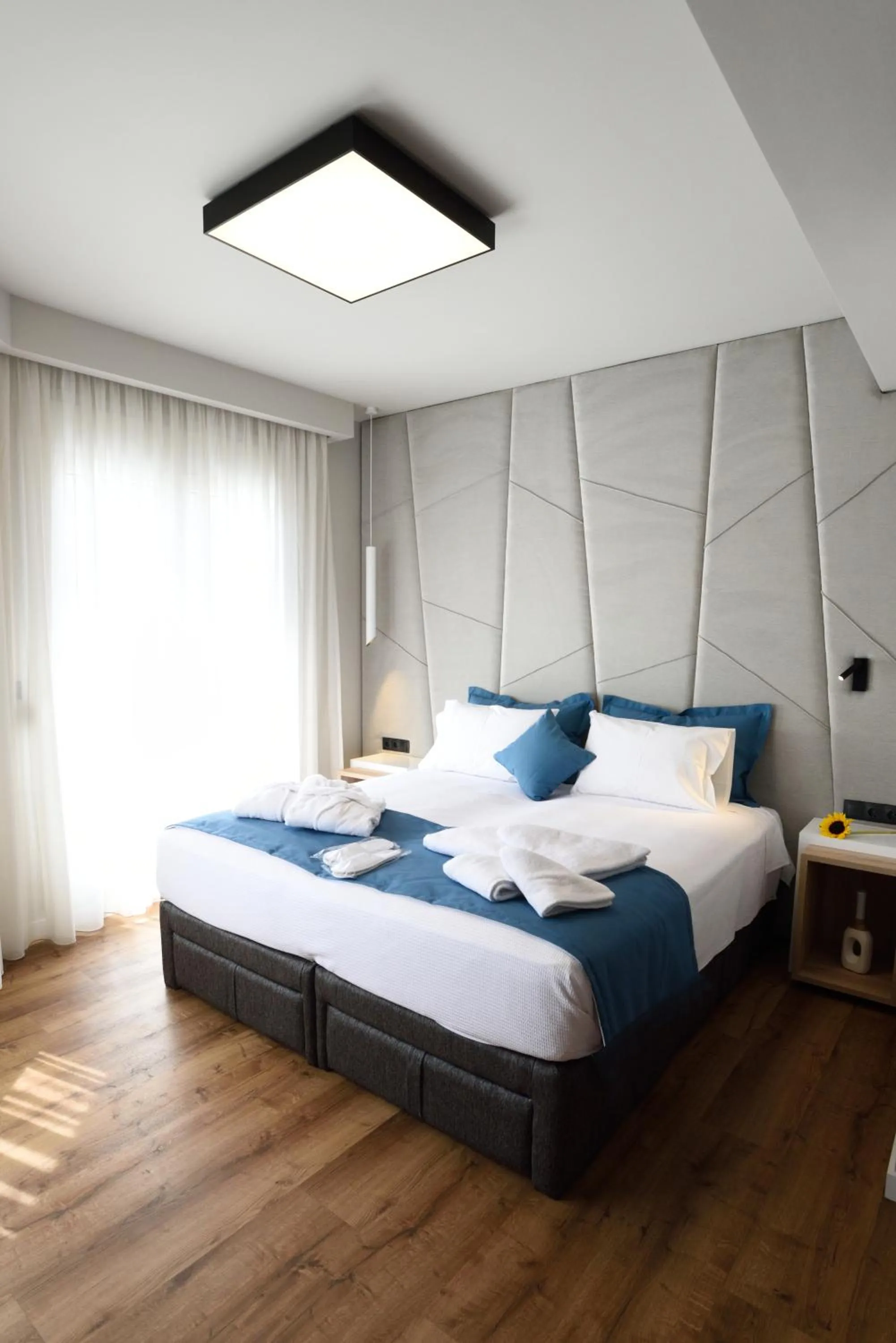 Bed in Magnifique Luxury Suites