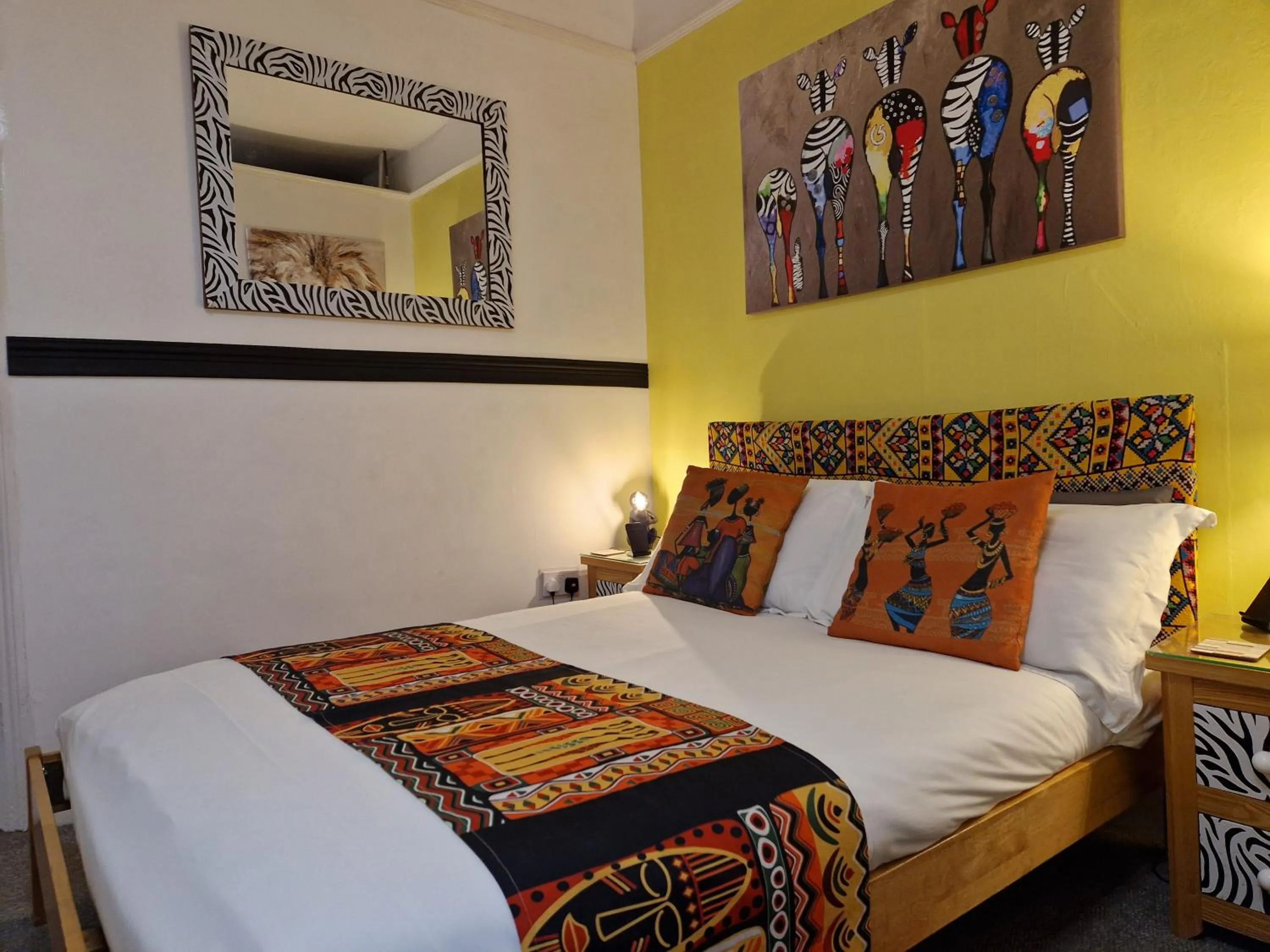 Bed in Ambassador Guest House