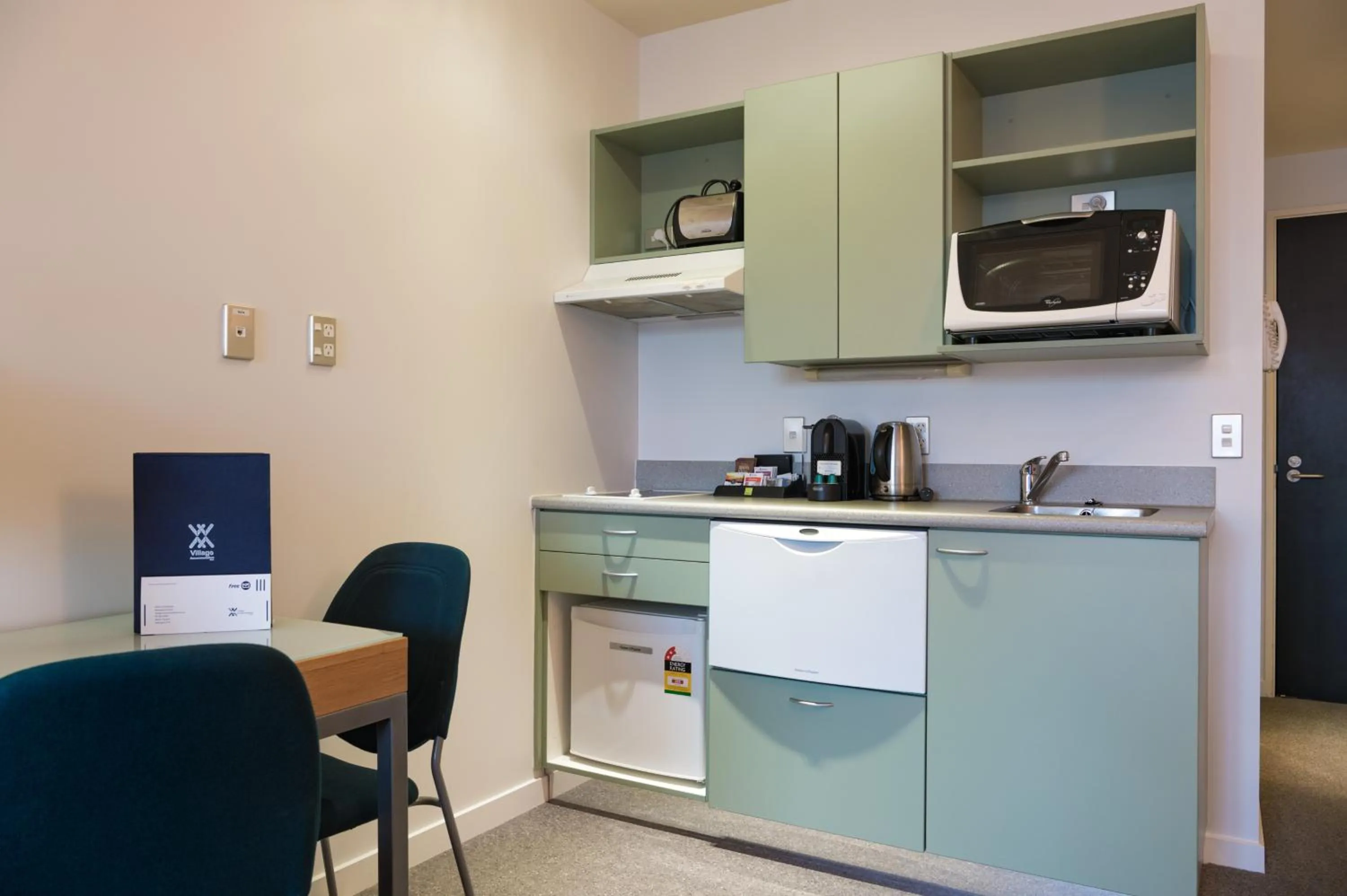 Kitchen or kitchenette in Astelia Apartment Hotel