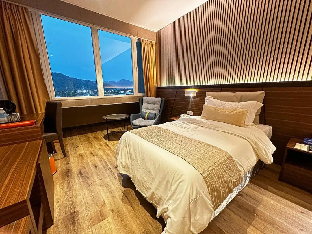 Bed in Pine Tree Hotel