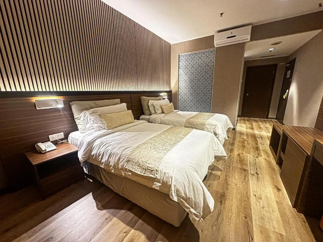 Bed in Pine Tree Hotel