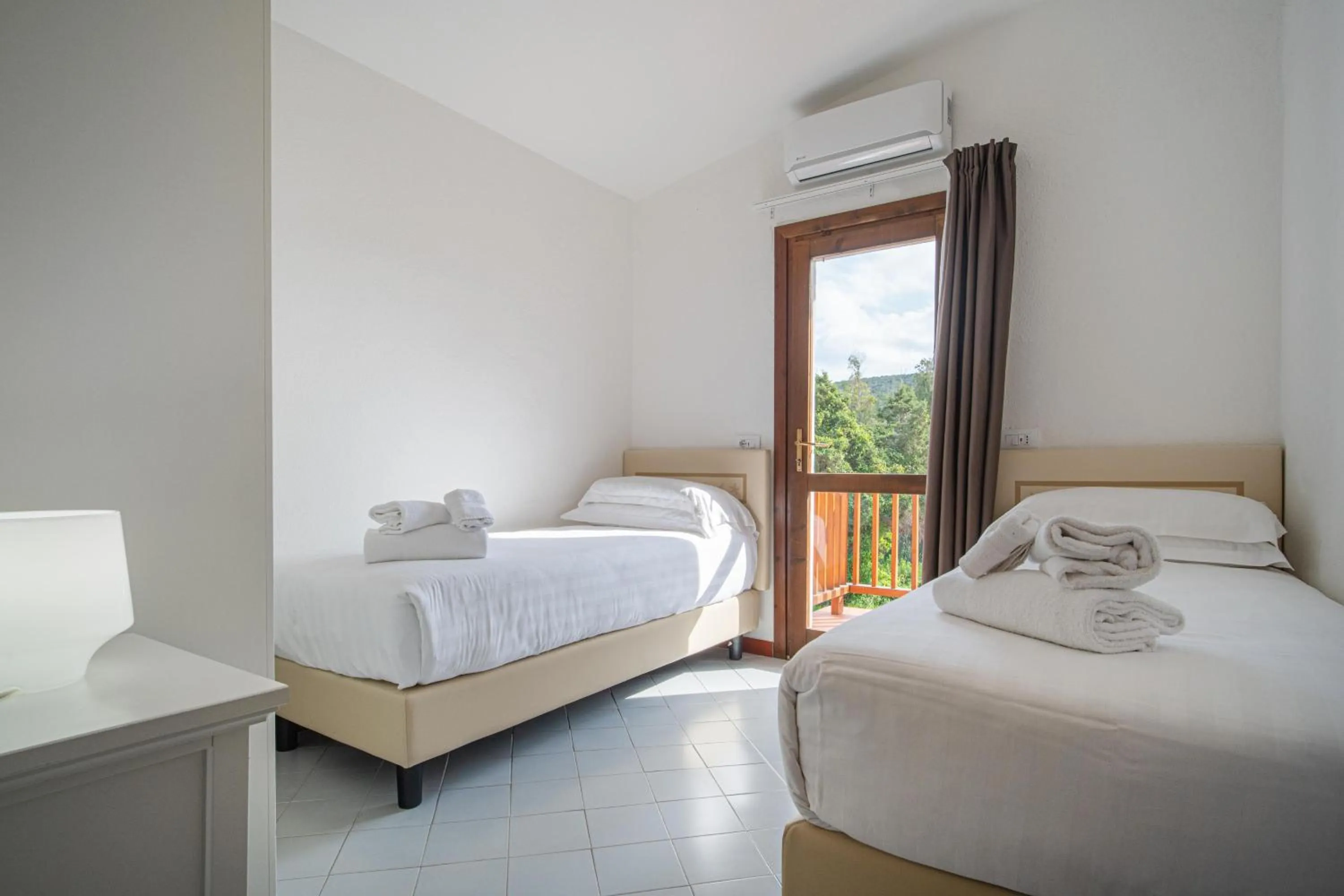 Bed in Felix Hotels - Residence Hotel Costa Serena