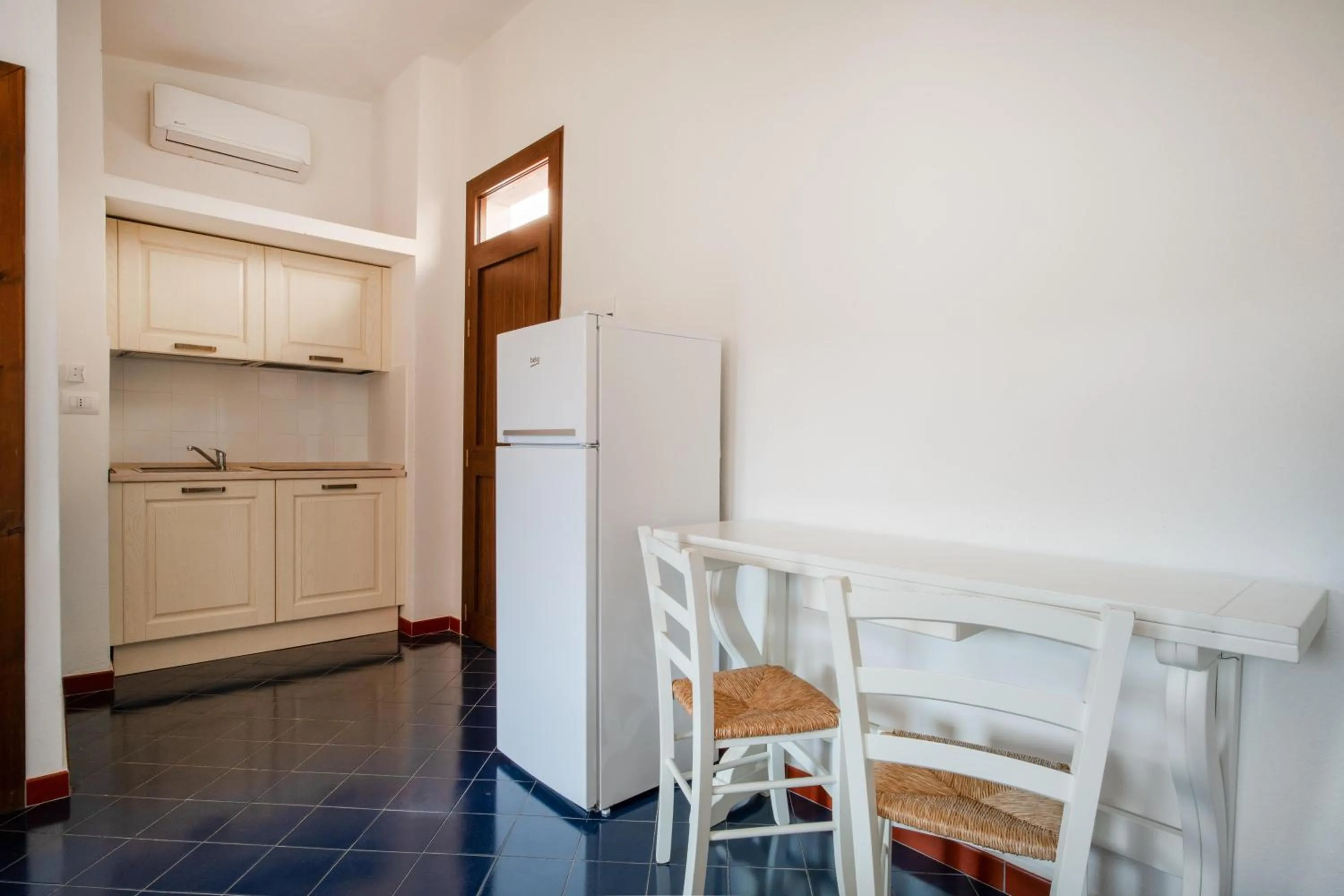 Kitchen or kitchenette in Felix Hotels - Residence Hotel Costa Serena