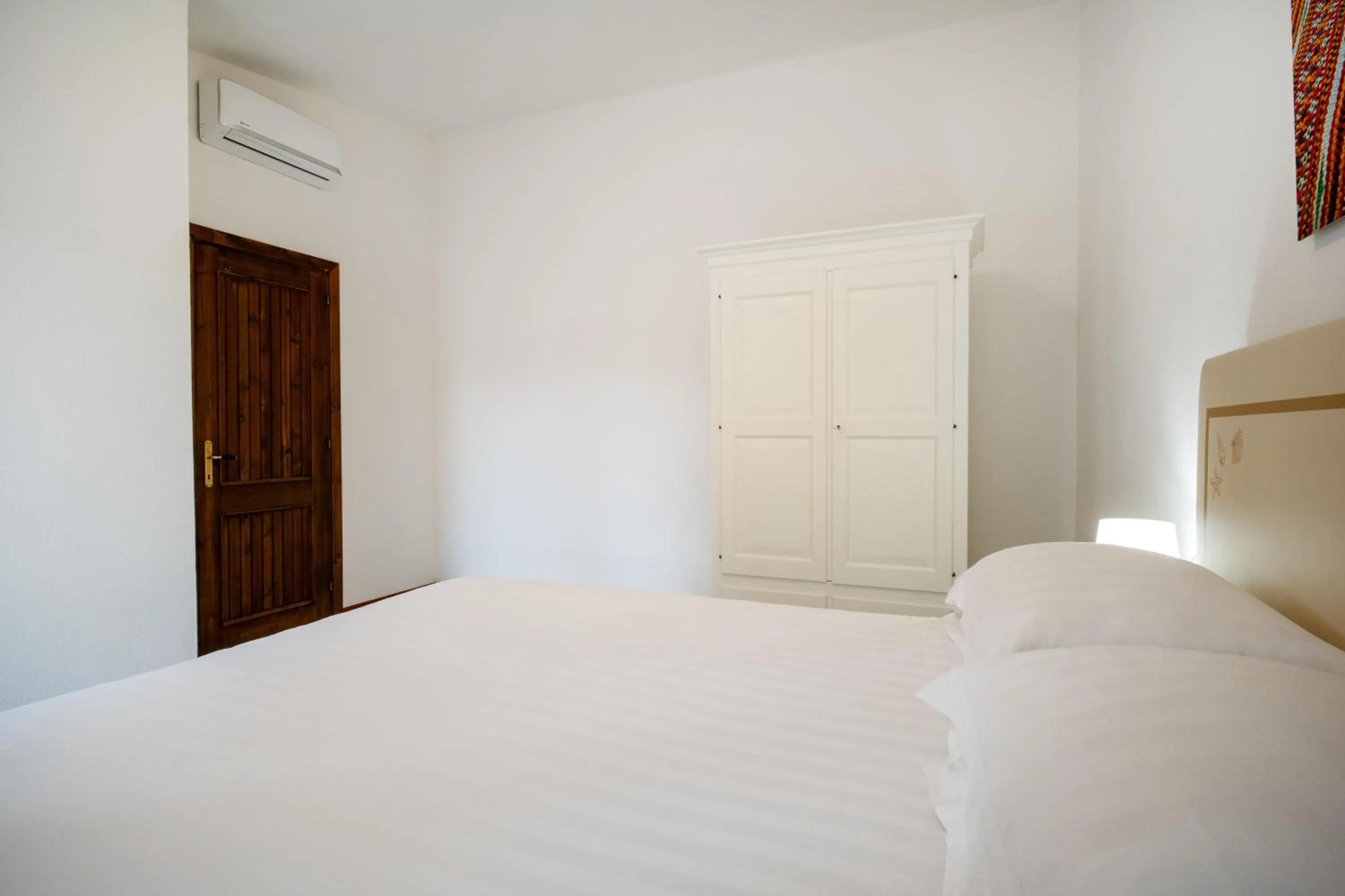 Bedroom, Bed in Felix Hotels - Residence Hotel Costa Serena