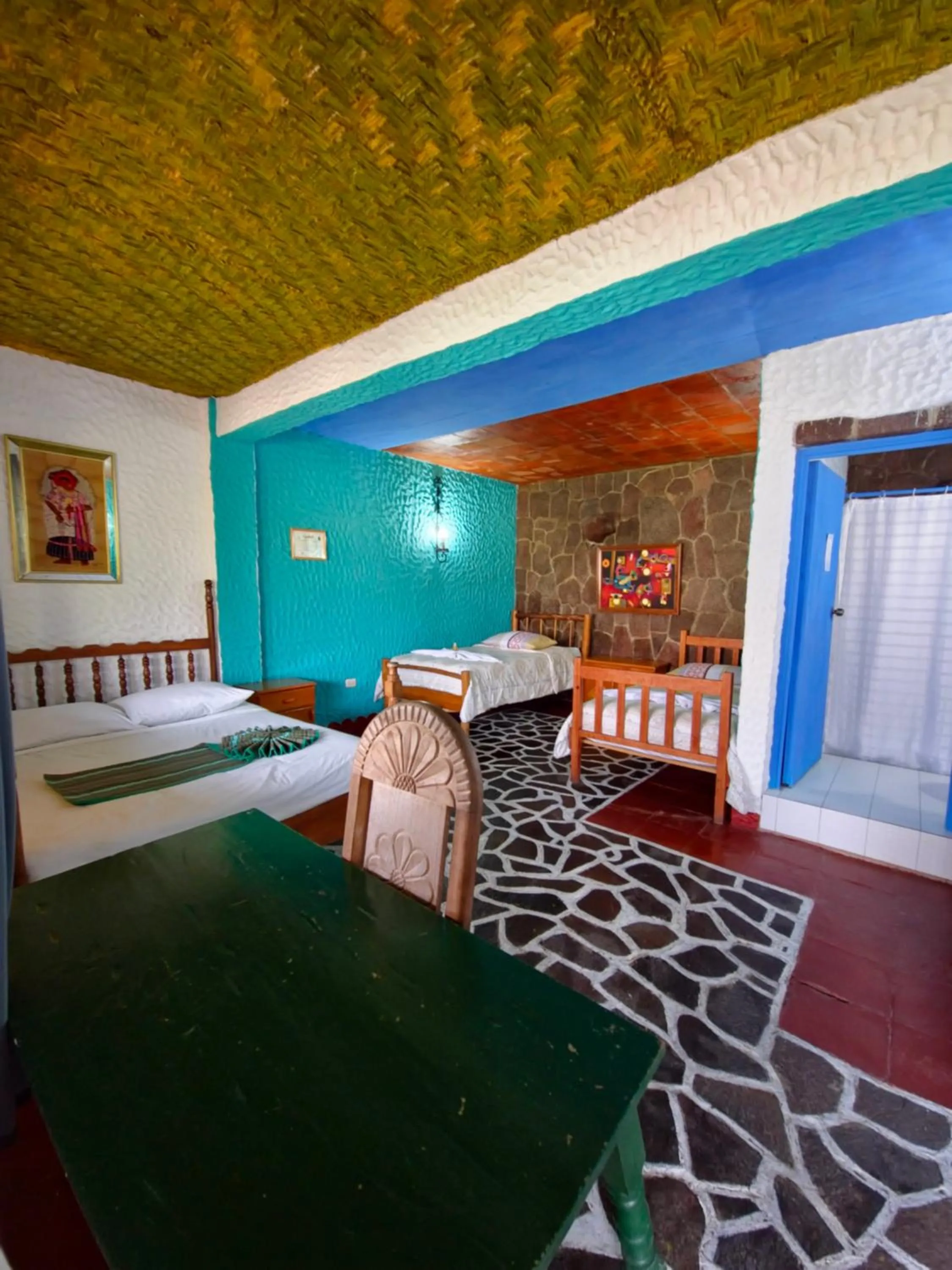 Living room, Bed in Eco Hotel Uxlabil Atitlan