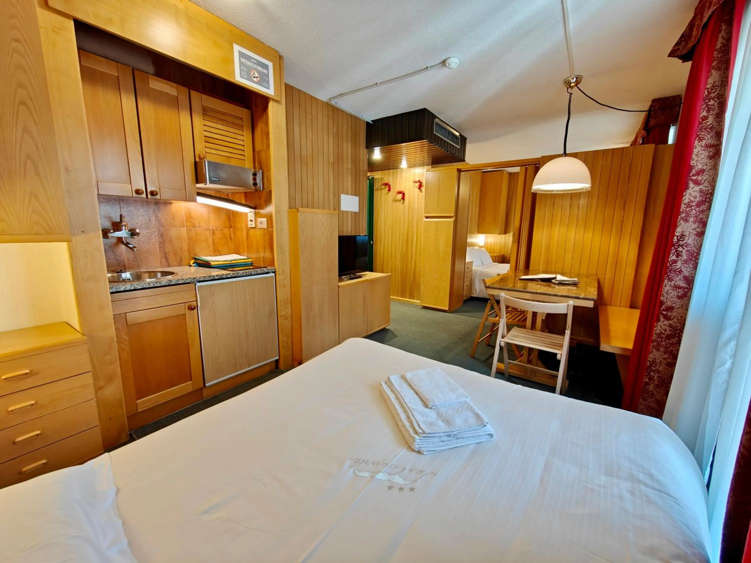 Living room, Bed in Residence Les Coupoles