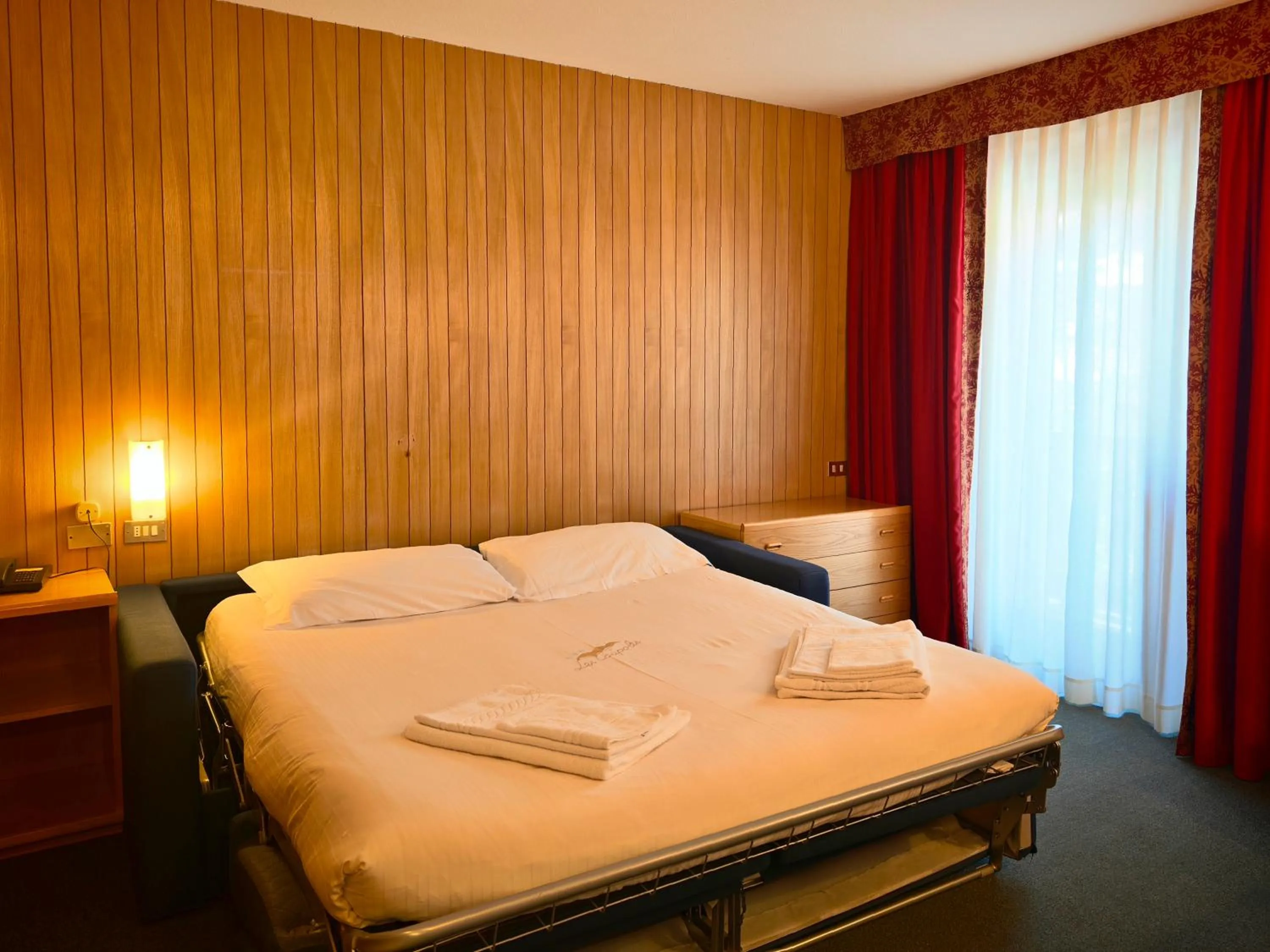 Living room, Bed in Residence Les Coupoles