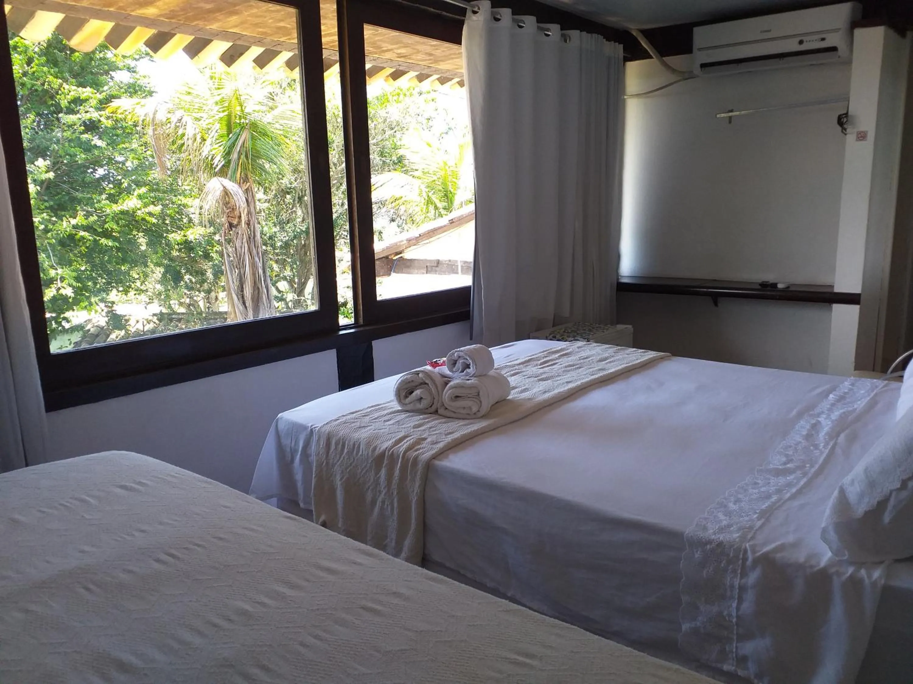 Photo of the whole room, Bed in Pousada Lua Nova Buzios