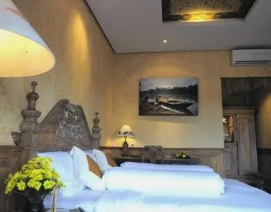 Bed in Omah Sinten Heritage Hotel & Resto