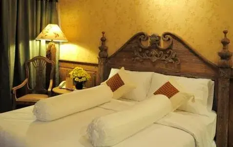 Bed in Omah Sinten Heritage Hotel & Resto Bed in Omah Sinten Heritage Hotel & Resto