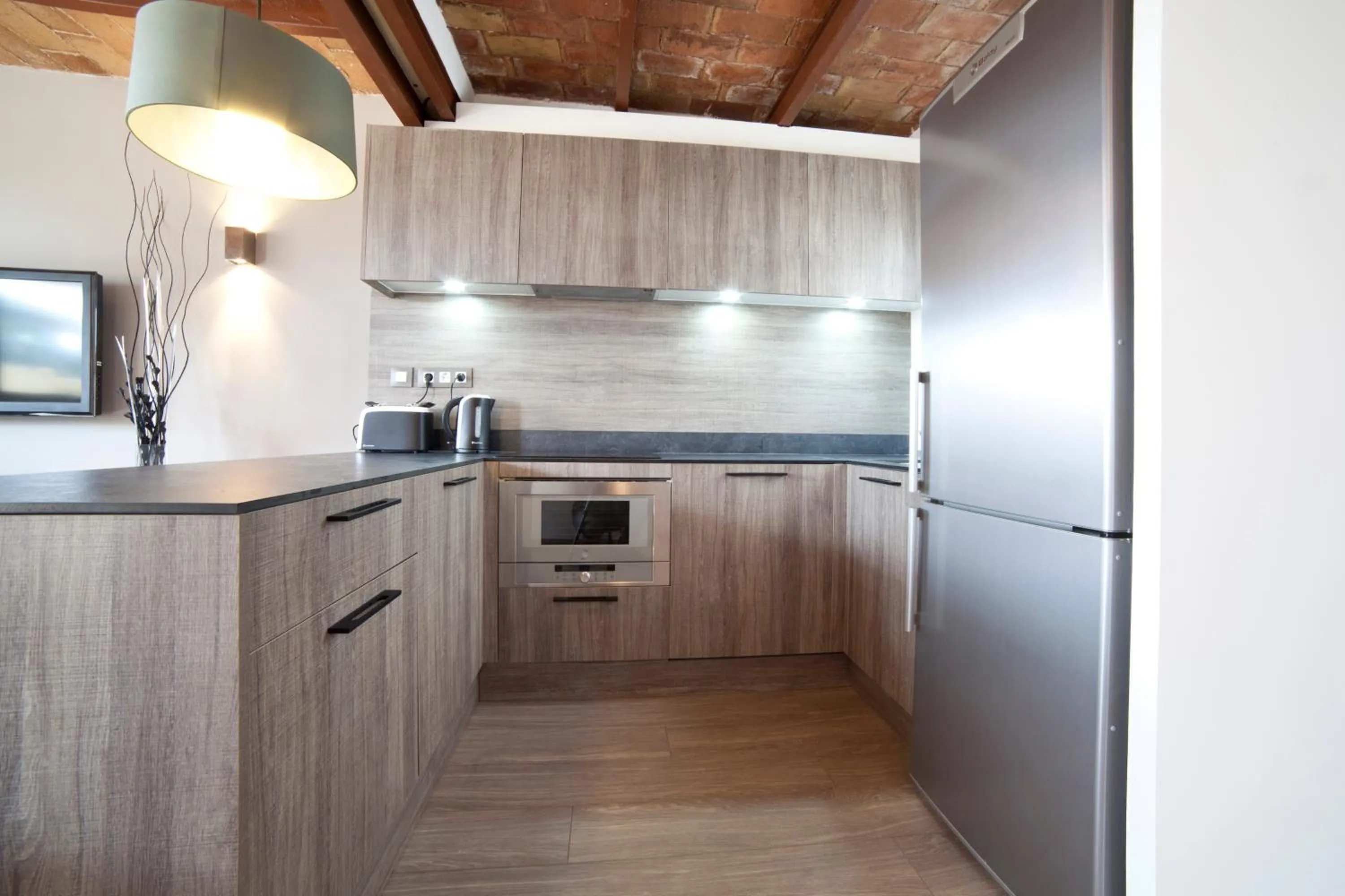 Kitchen or kitchenette in Serennia Apartamentos Ramblas - Plaça Catalunya