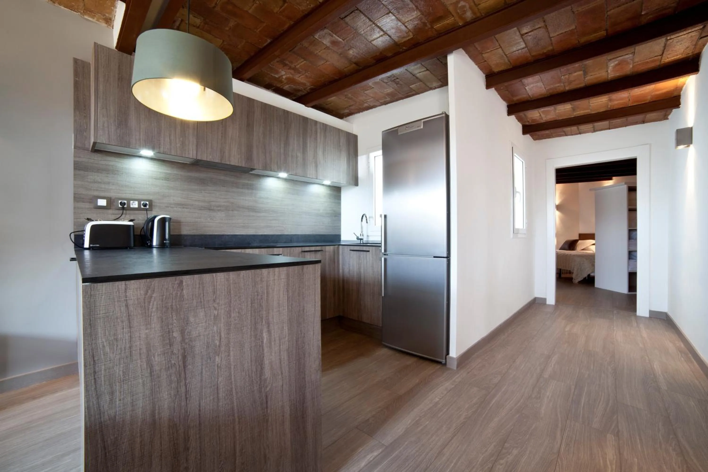 Kitchen or kitchenette in Serennia Apartamentos Ramblas - Plaça Catalunya