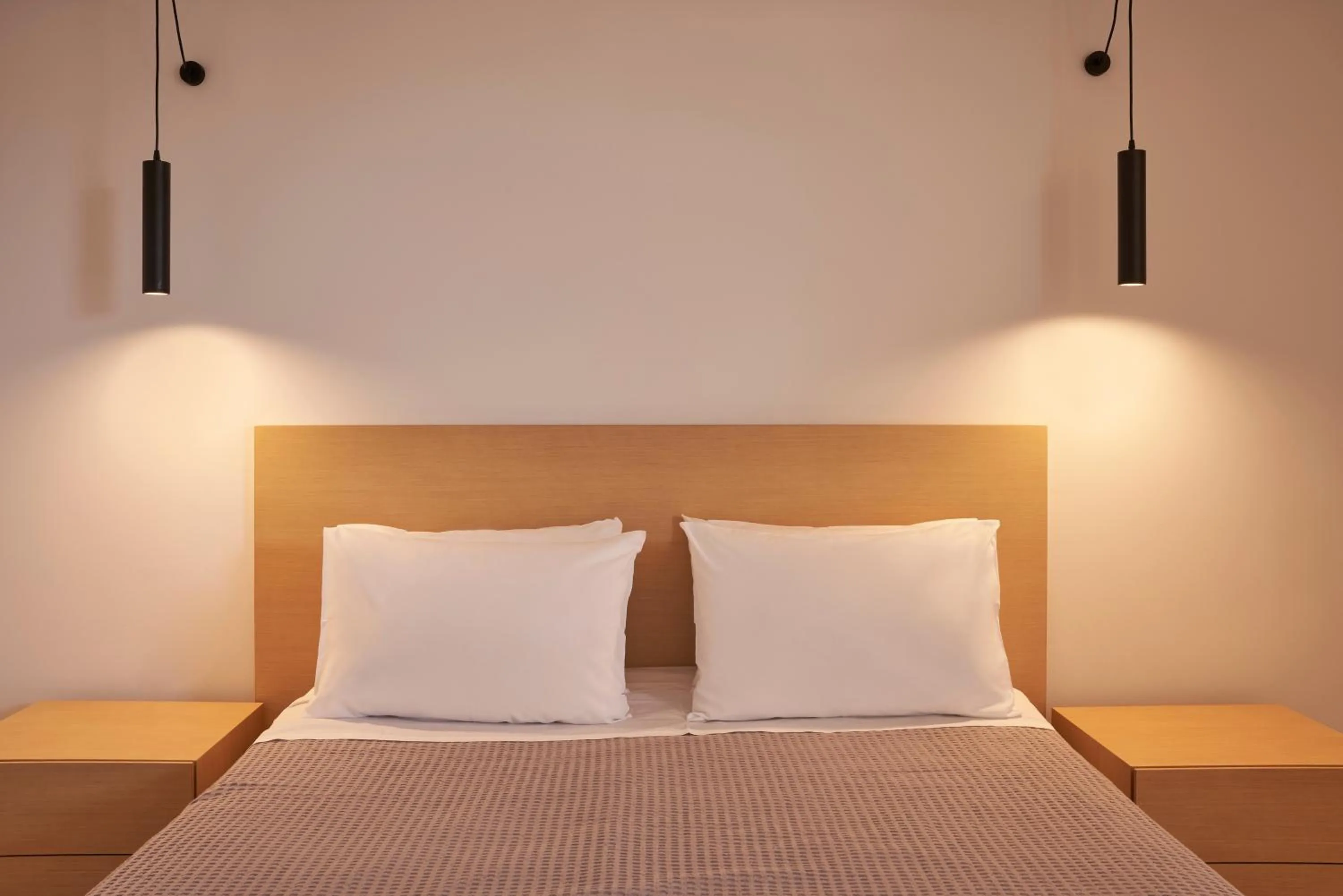 Bed in Xenia Poros Image Hotel