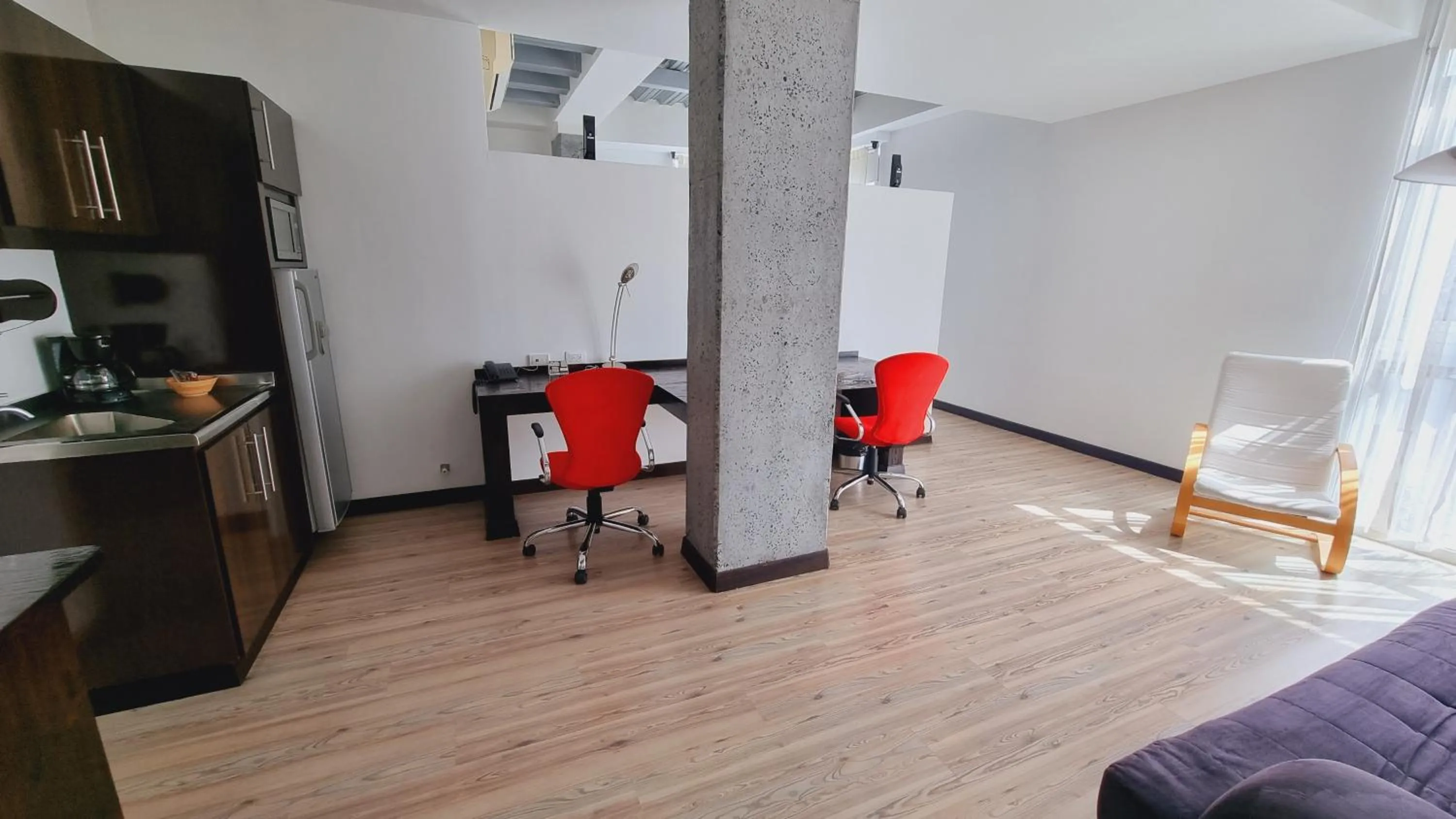 Living room in Habitat Suites Hotel By GHO Hoteles