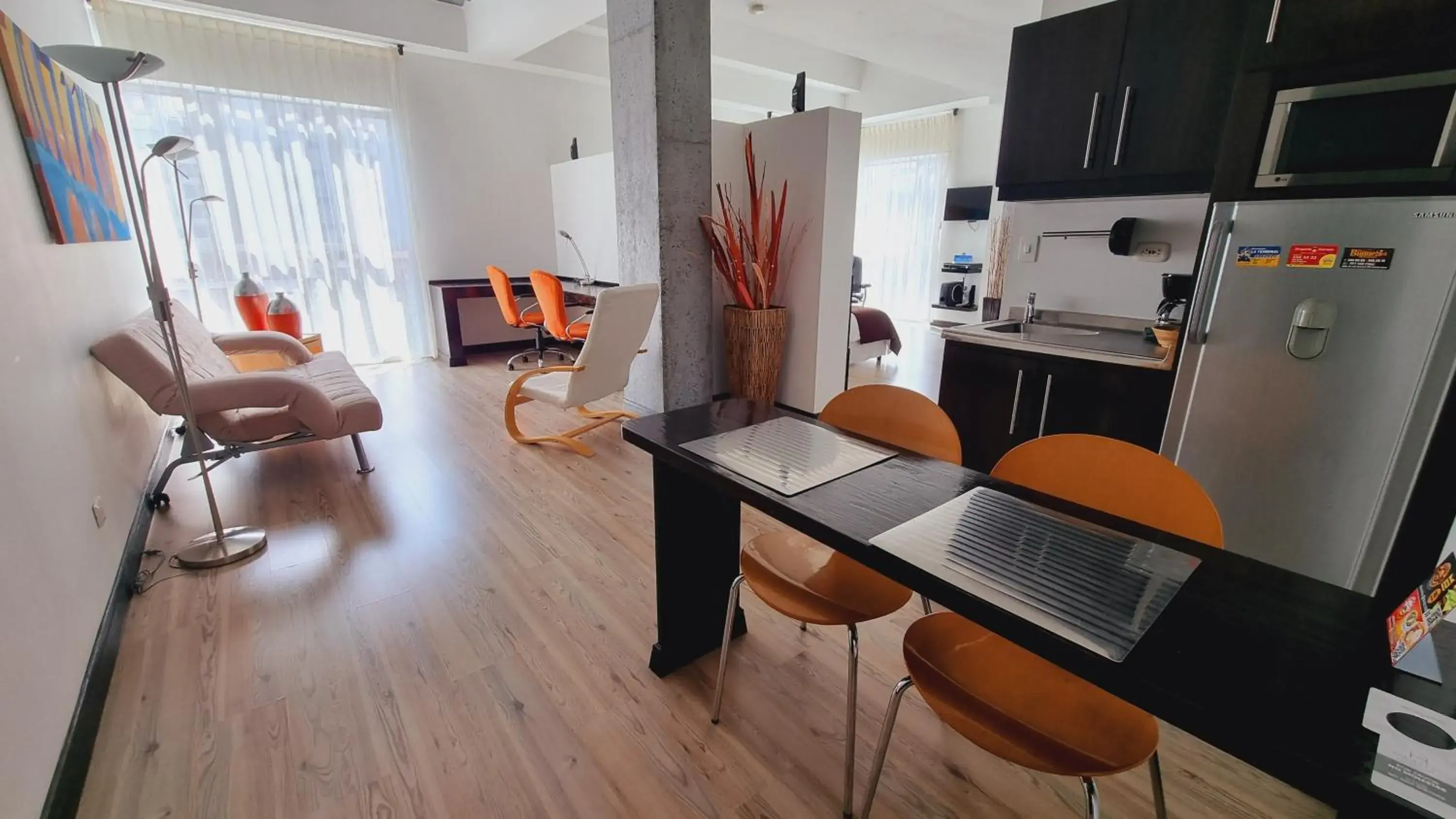 Living room in Habitat Suites Hotel By GHO Hoteles Living room in Habitat Suites Hotel By GHO Hoteles