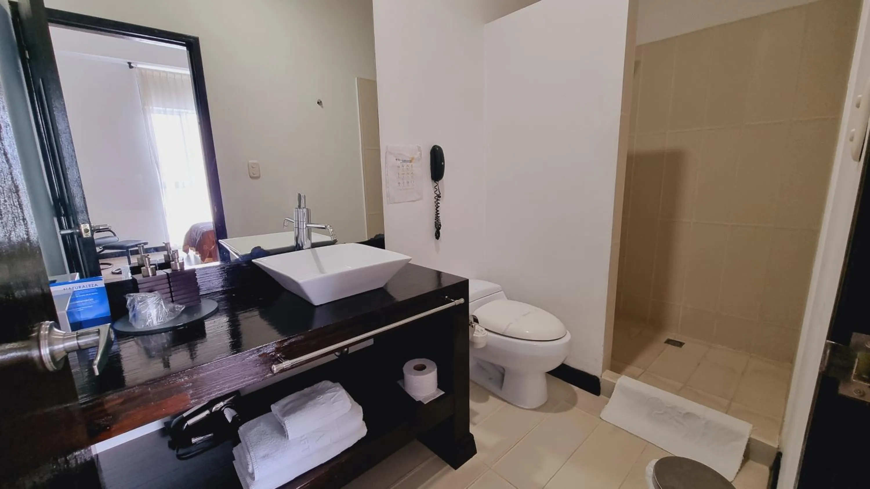 Bathroom in Habitat Suites Hotel By GHO Hoteles